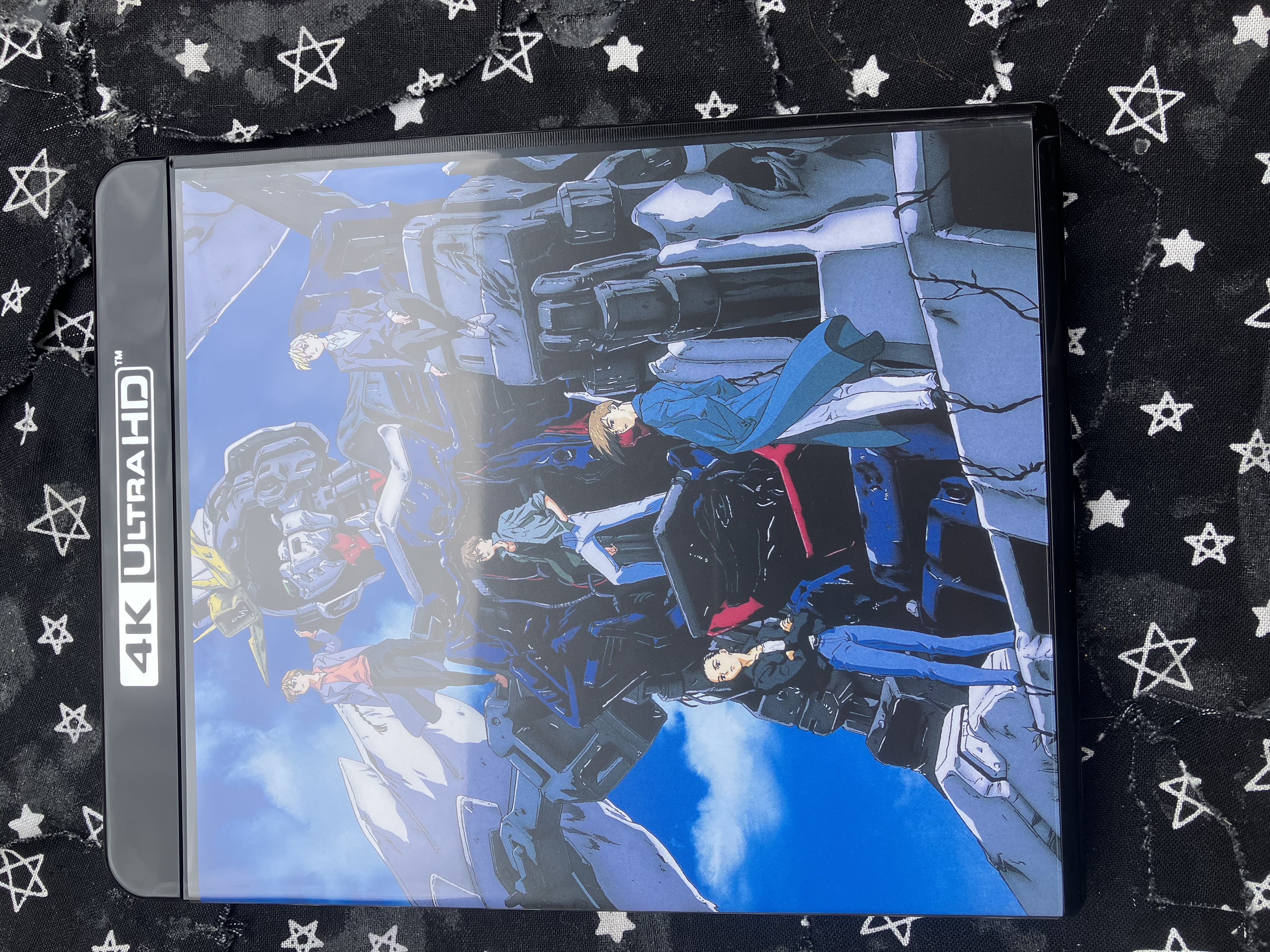 Front of Gundam wing endless waltz special edition dvd case with the boys standing on the ruins of wing zero