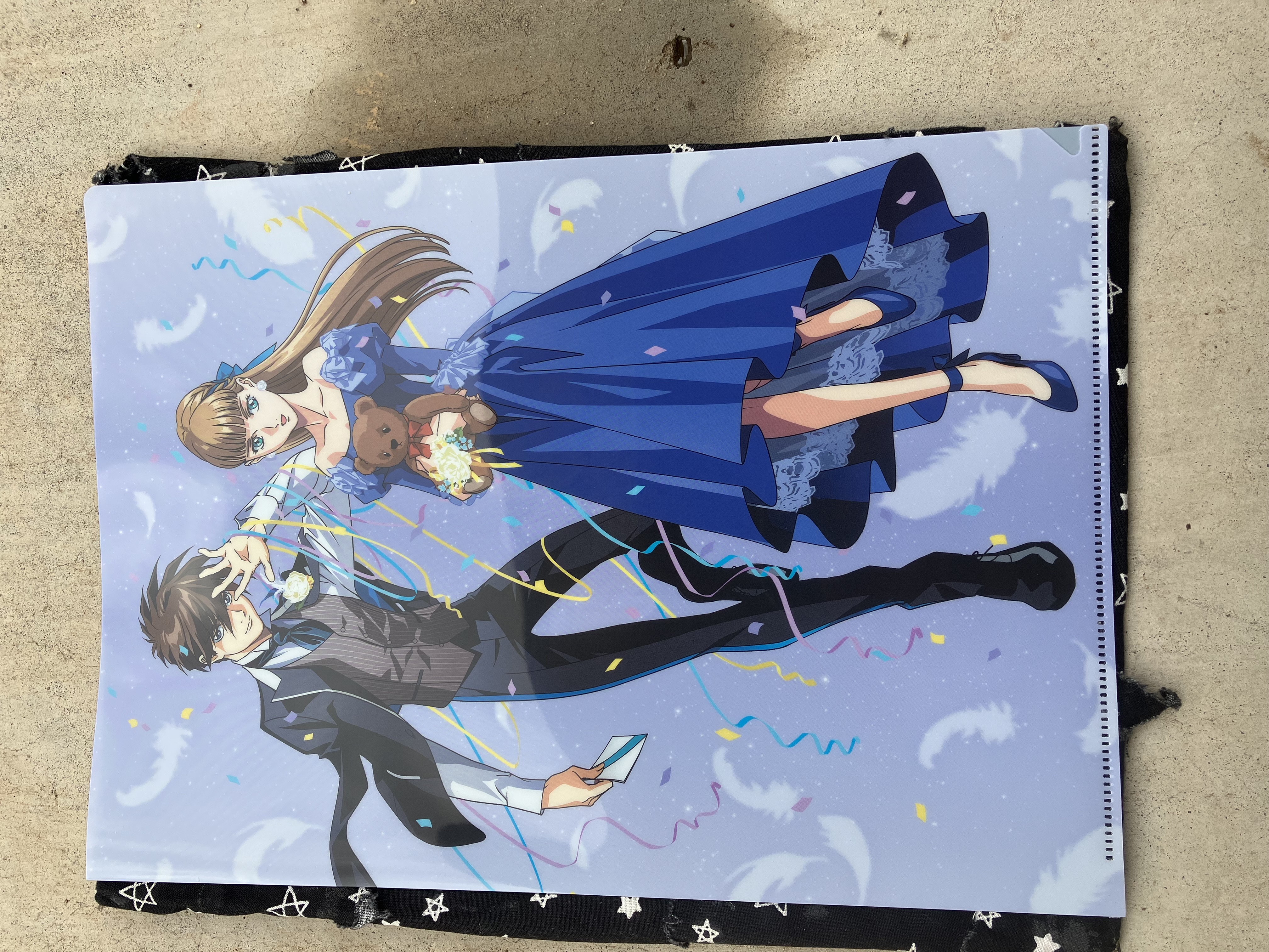 Front of clear file with Gundam wing Heero and Relena in formal attire.