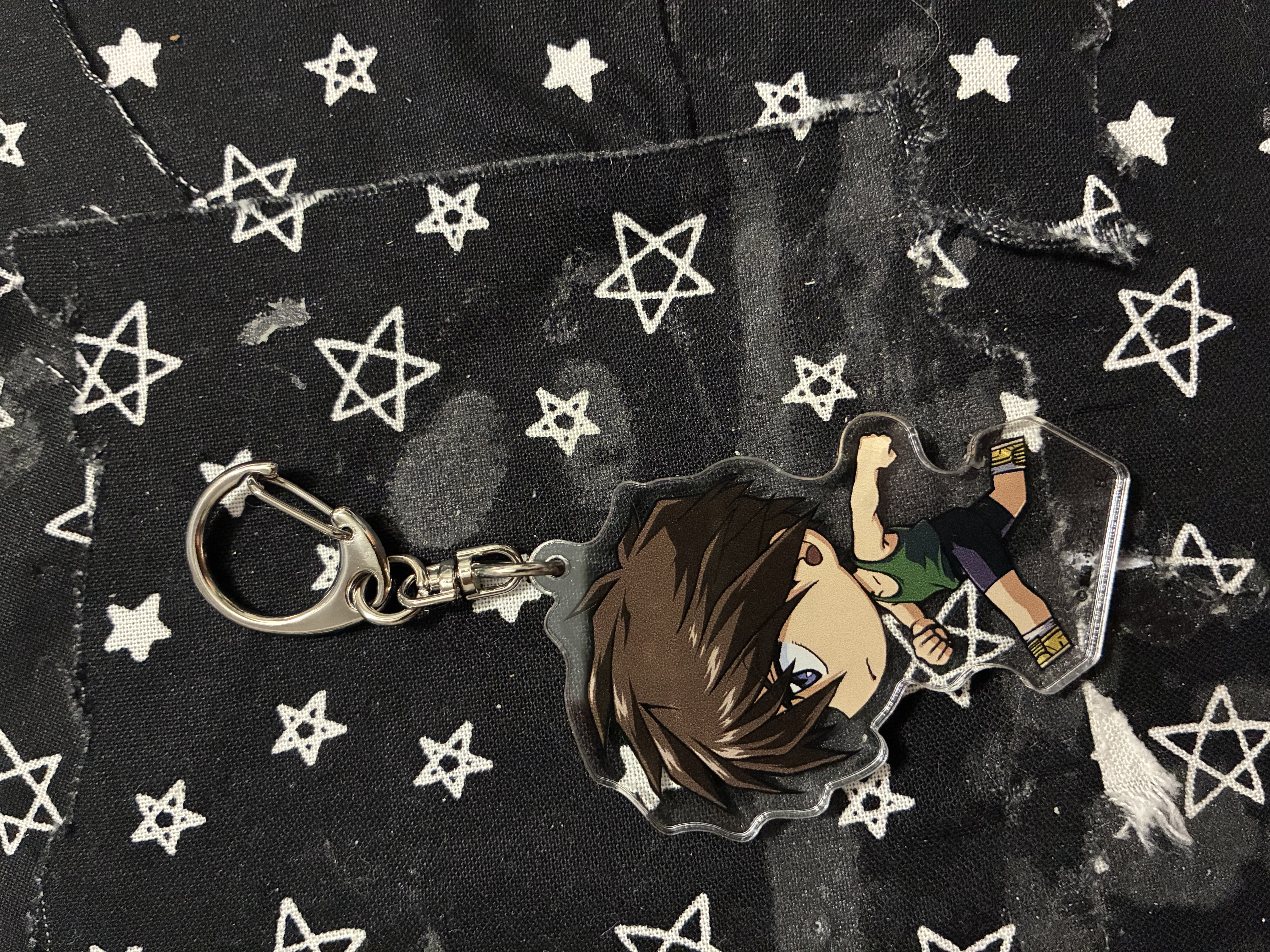 Acrylic charm keychain of Heero in a running pose.