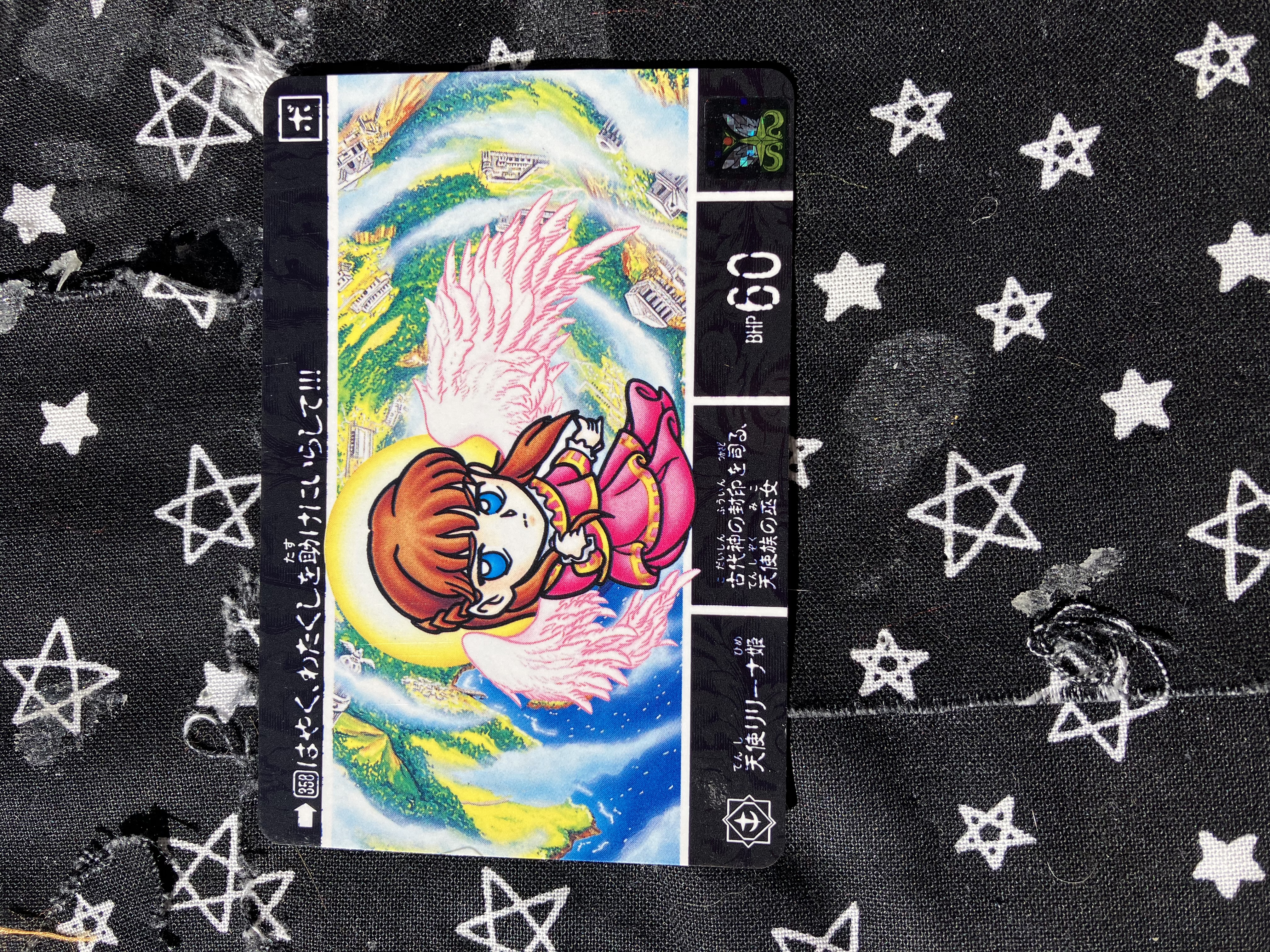 A Bandai SD Gundam Gaiden Carddass collectible trading card featuring the character Relena reimagined as an angel.