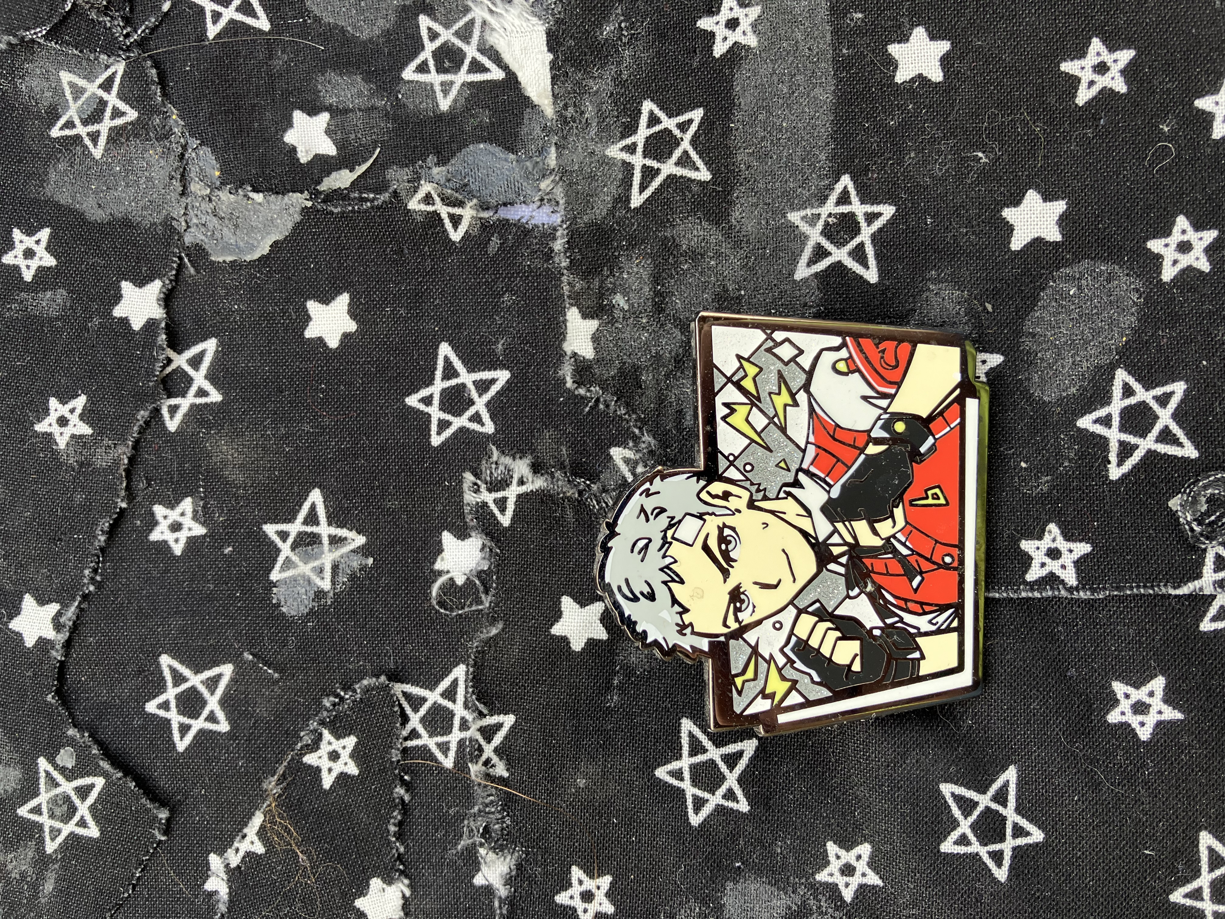 Enamel pin of Persona 3 Akihiko with his fists raised and lighting bolts around him.