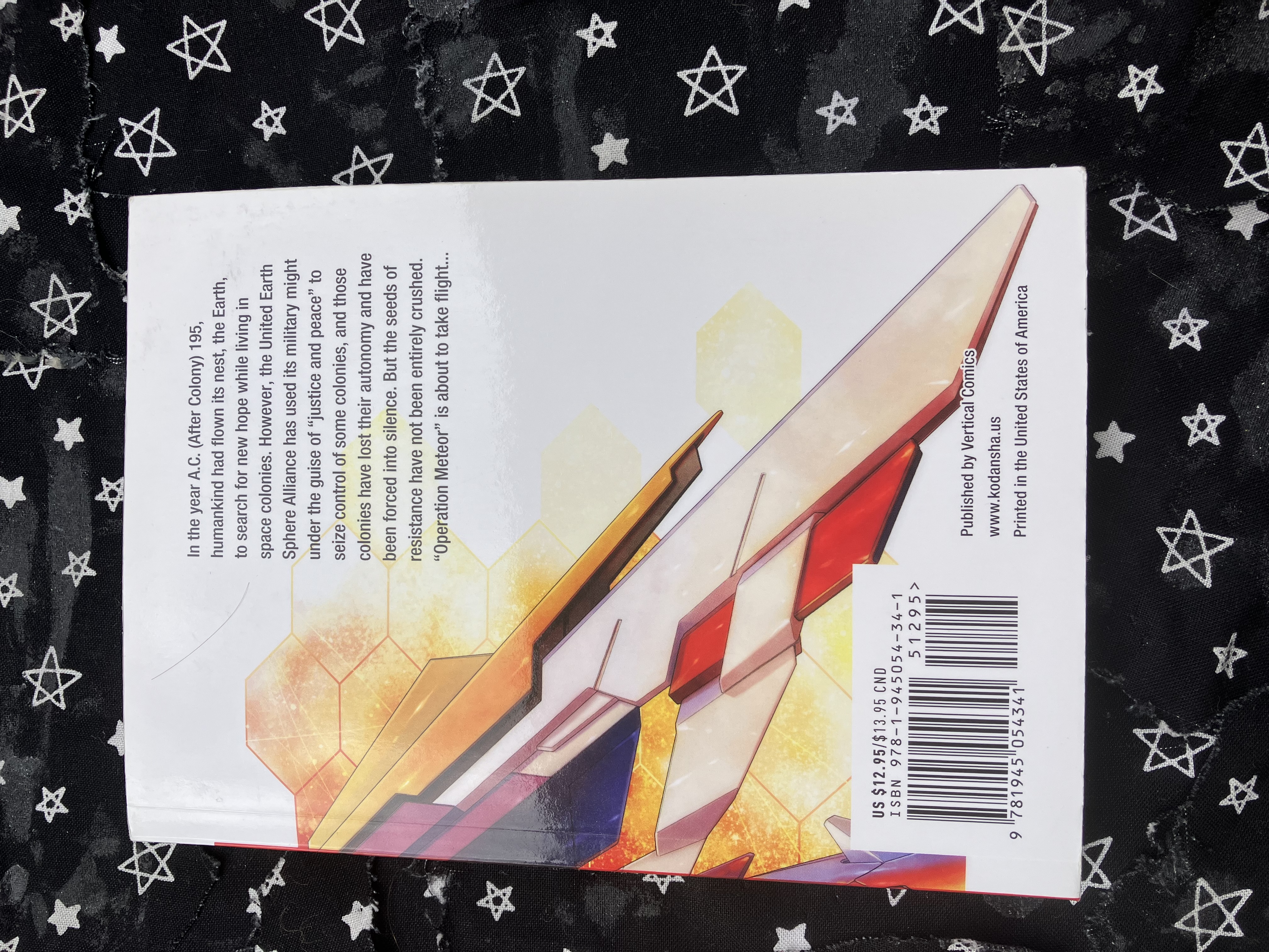Back of volume 1 of the manga Mobile Suit Gundam Wing: Endless Waltz: Glory of the Losers with part of Wing's wing