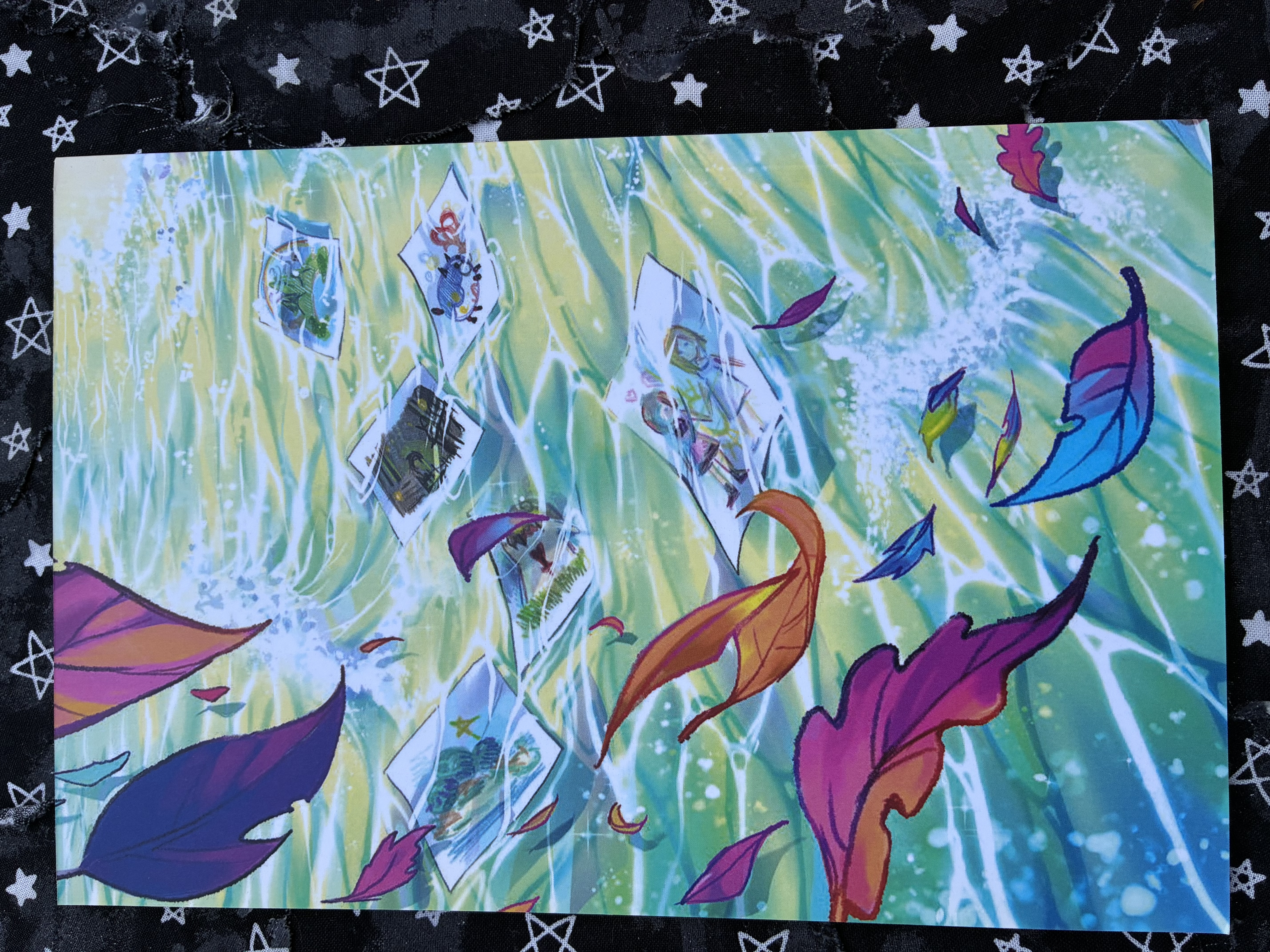Back of Born from the waves: a namine zine with Namine drawings in waves and different leaves floating by in the air.