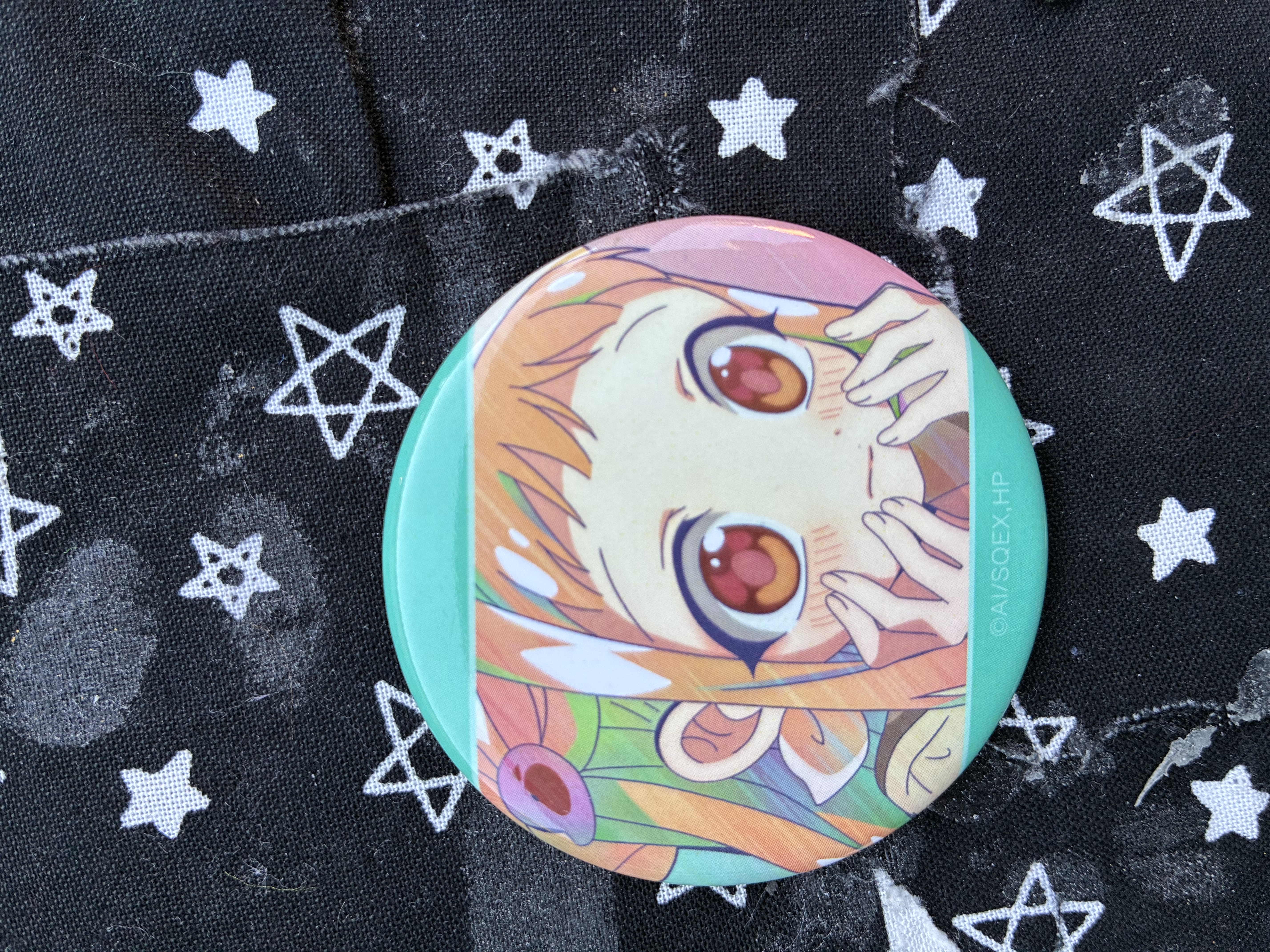 Button of Jibaku shounen Hanako kun Nene blushing with her hands on her cheek.