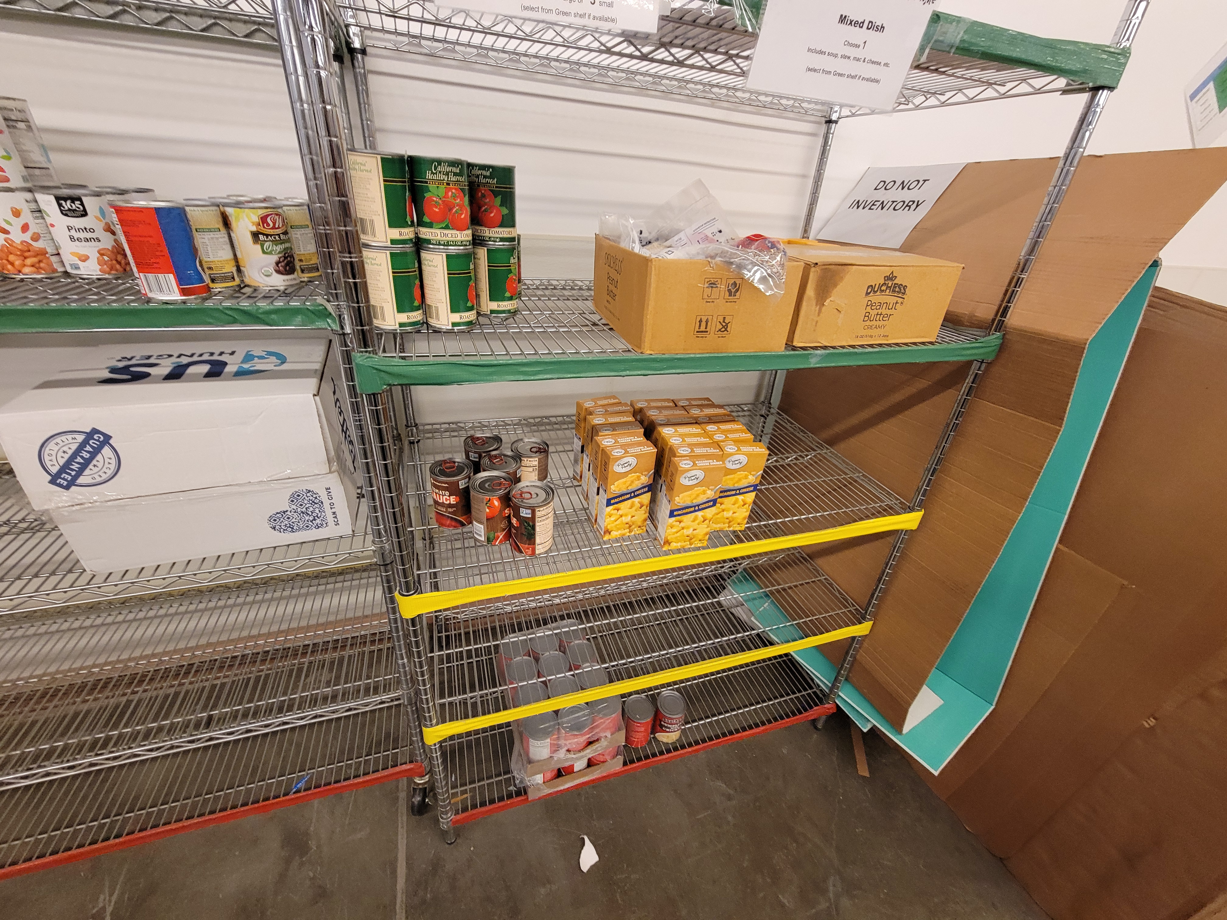 Shelves of canned and boxed food.