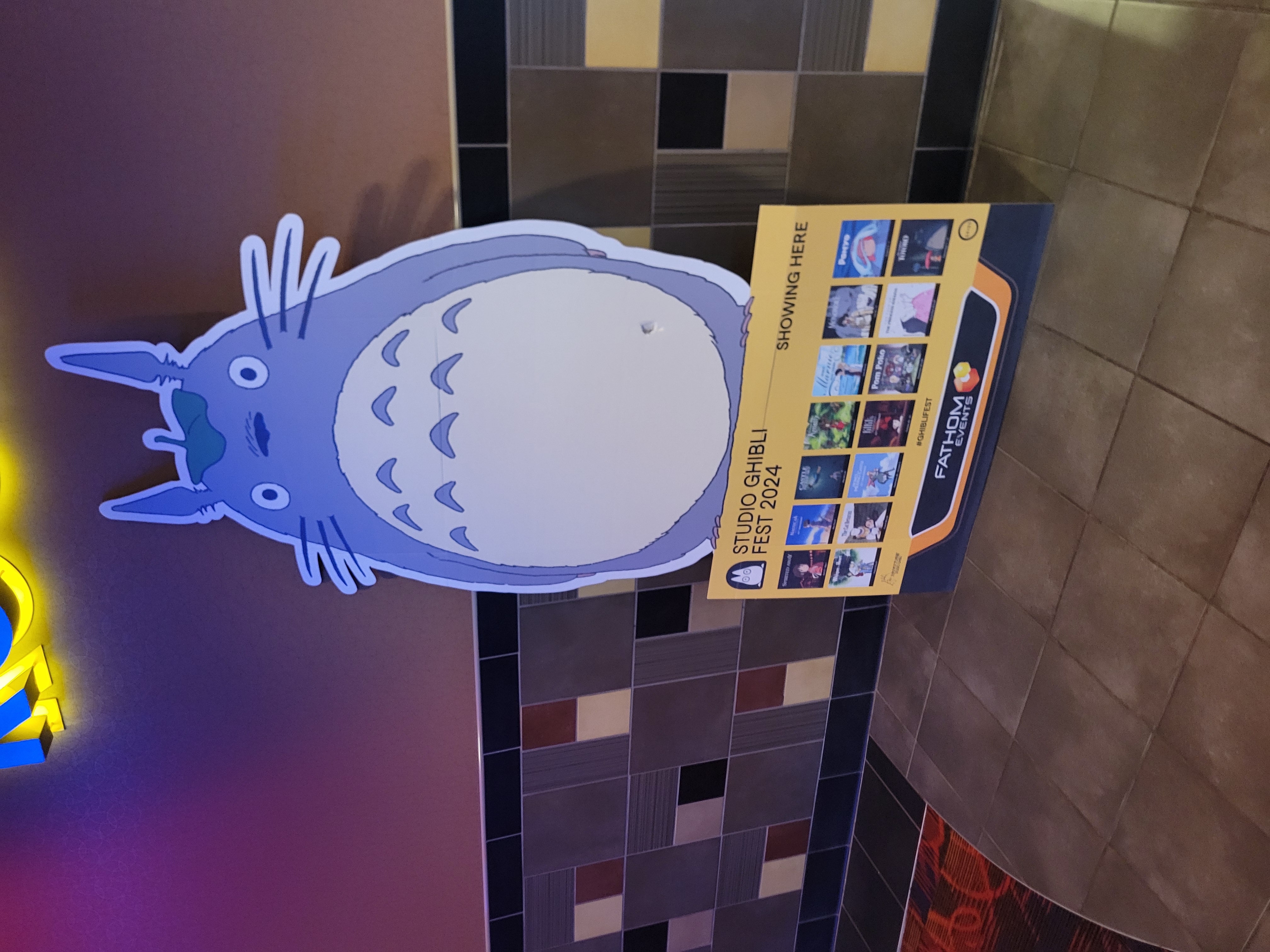 Cardboard stand of Totoro with each Ghibli movies playing for the festival.