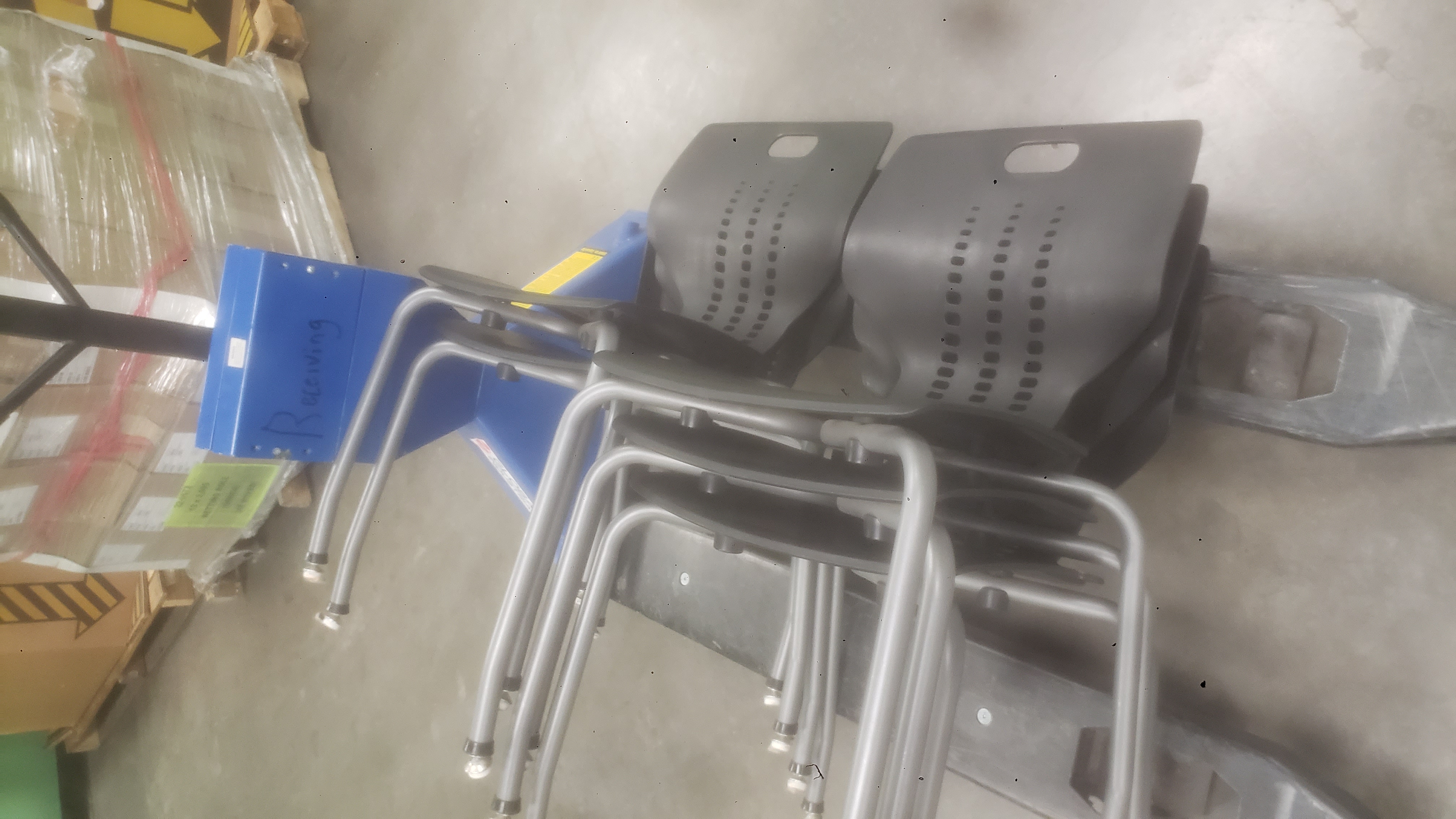 Chairs on a pallet jack.