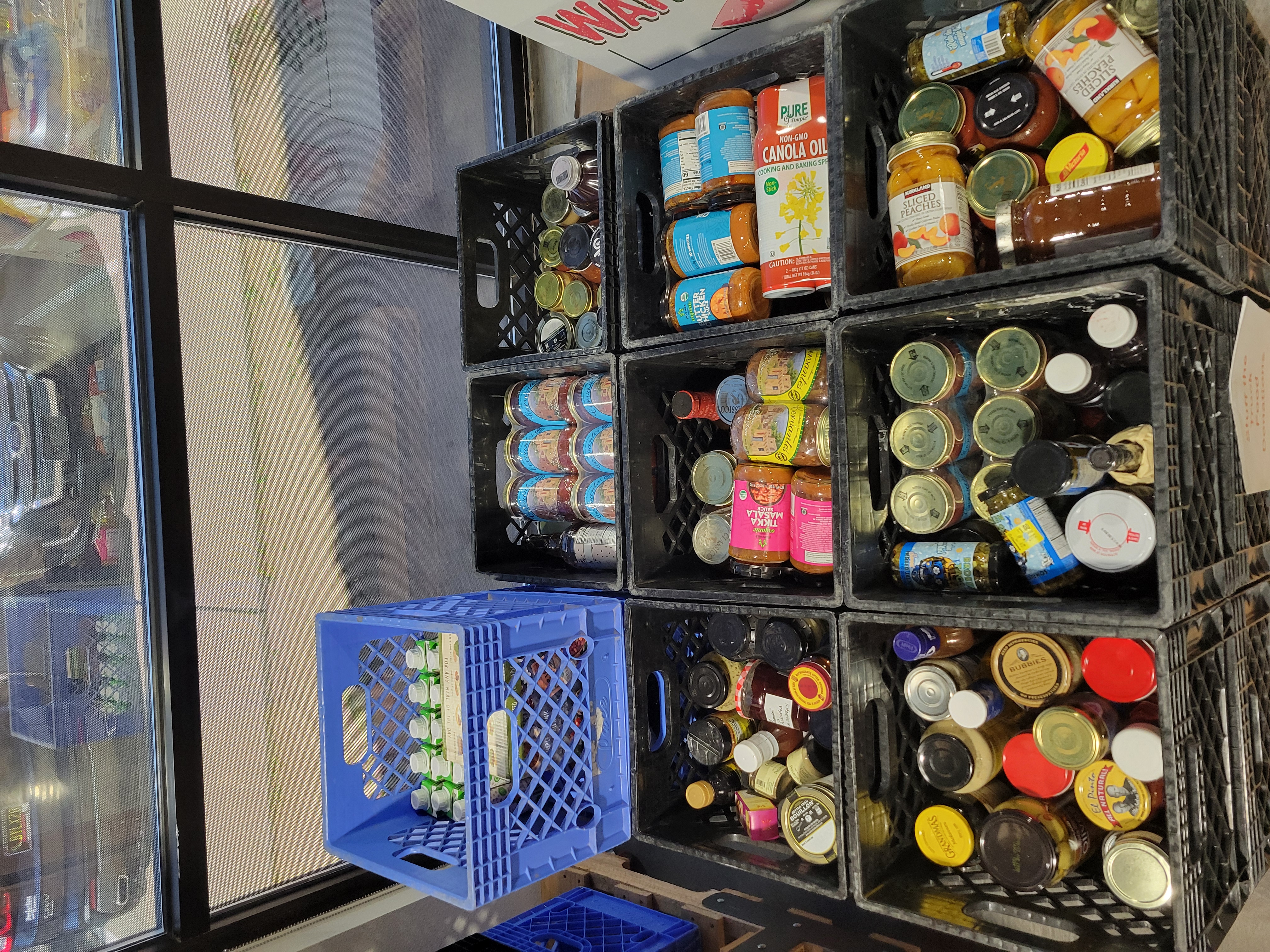 Crates filled with glass jars.