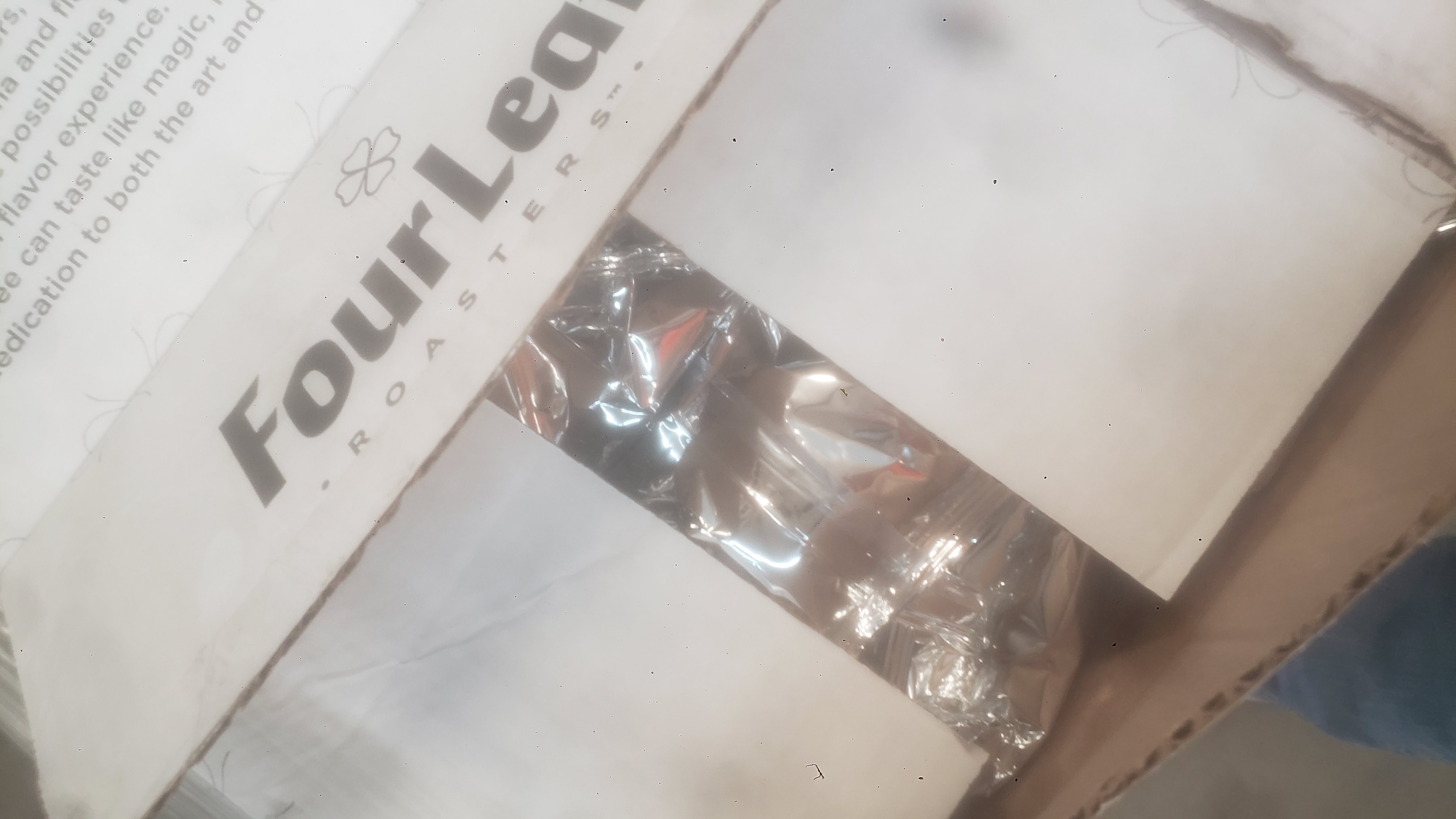 Coffee packets in a cardboard box.
