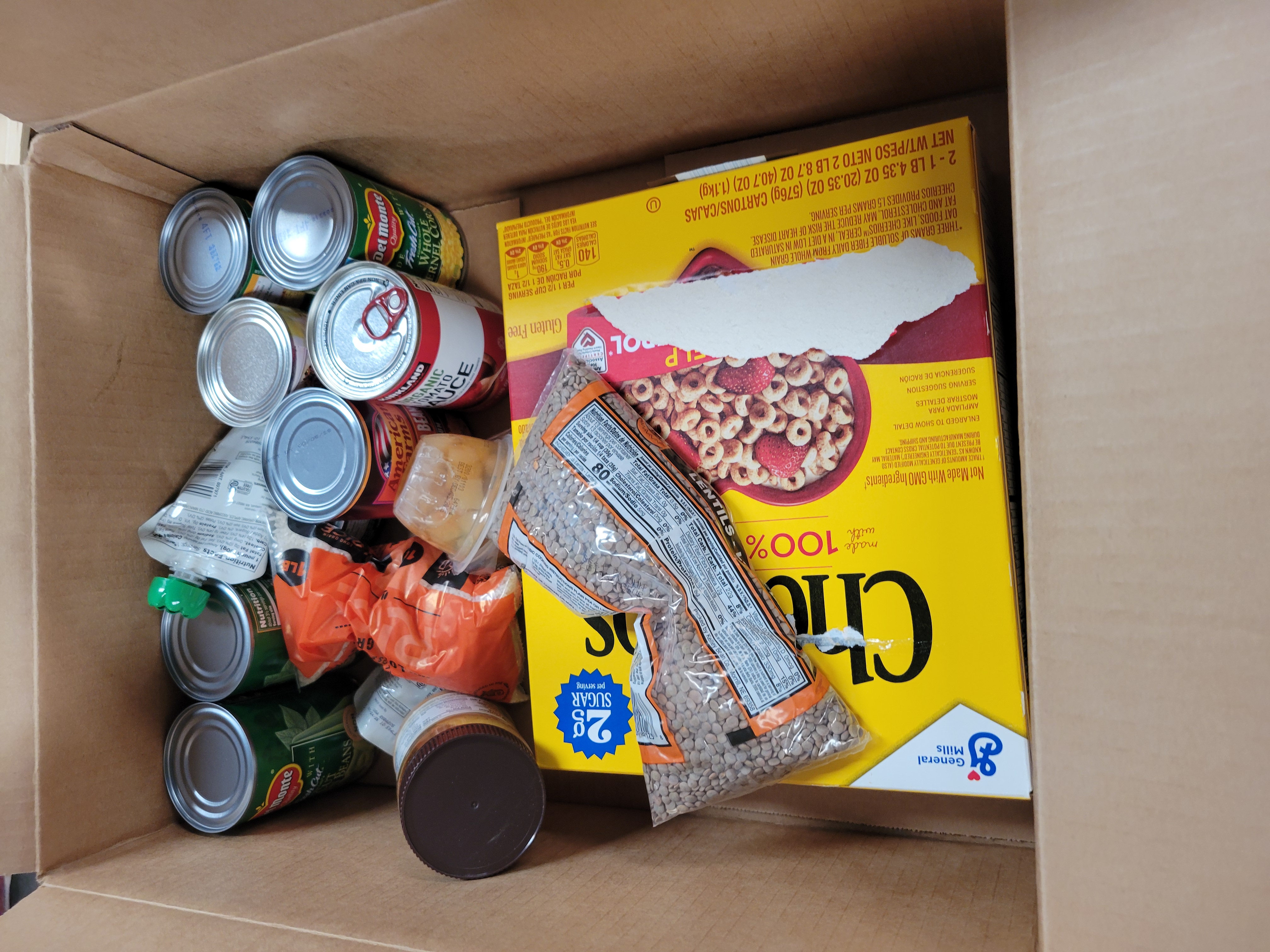 Cardboard box full of food.