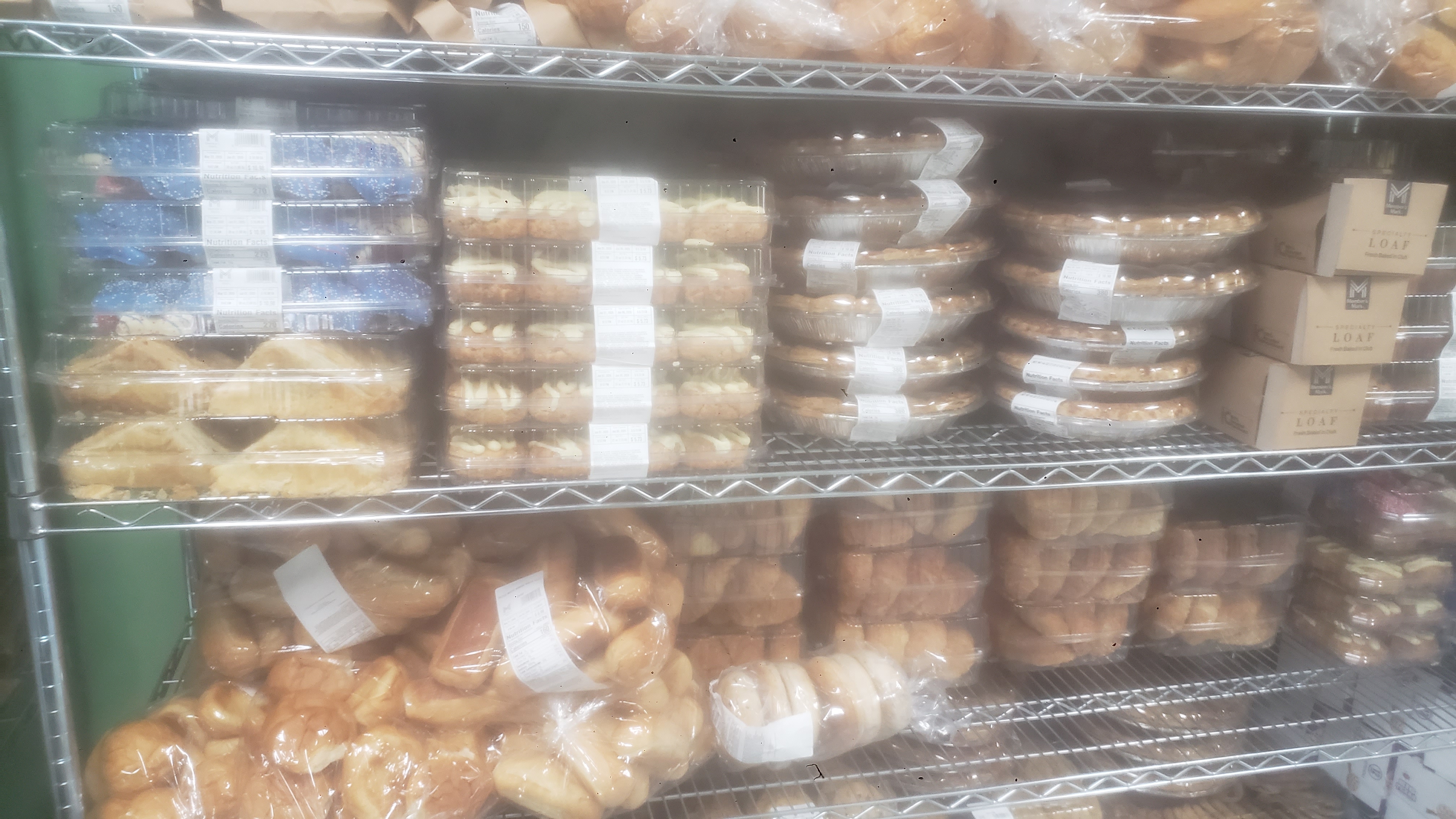 A variety of packaged baked goods on a shelf.