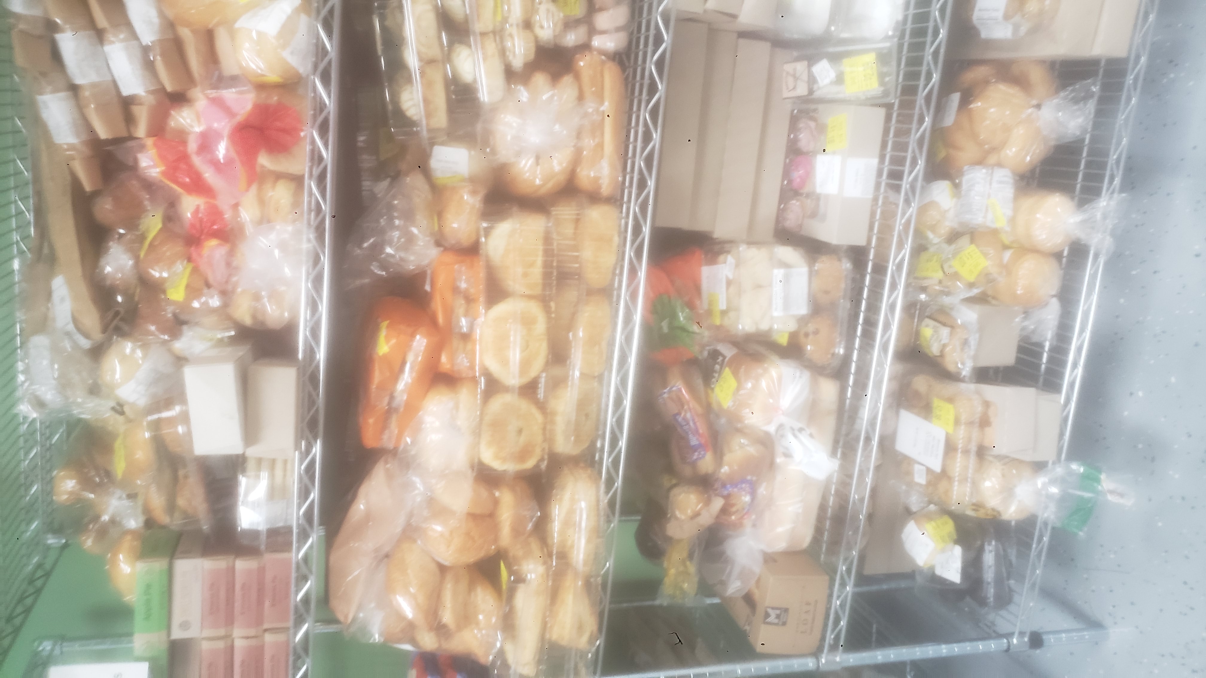 A variety of packaged baked goods on a shelf.