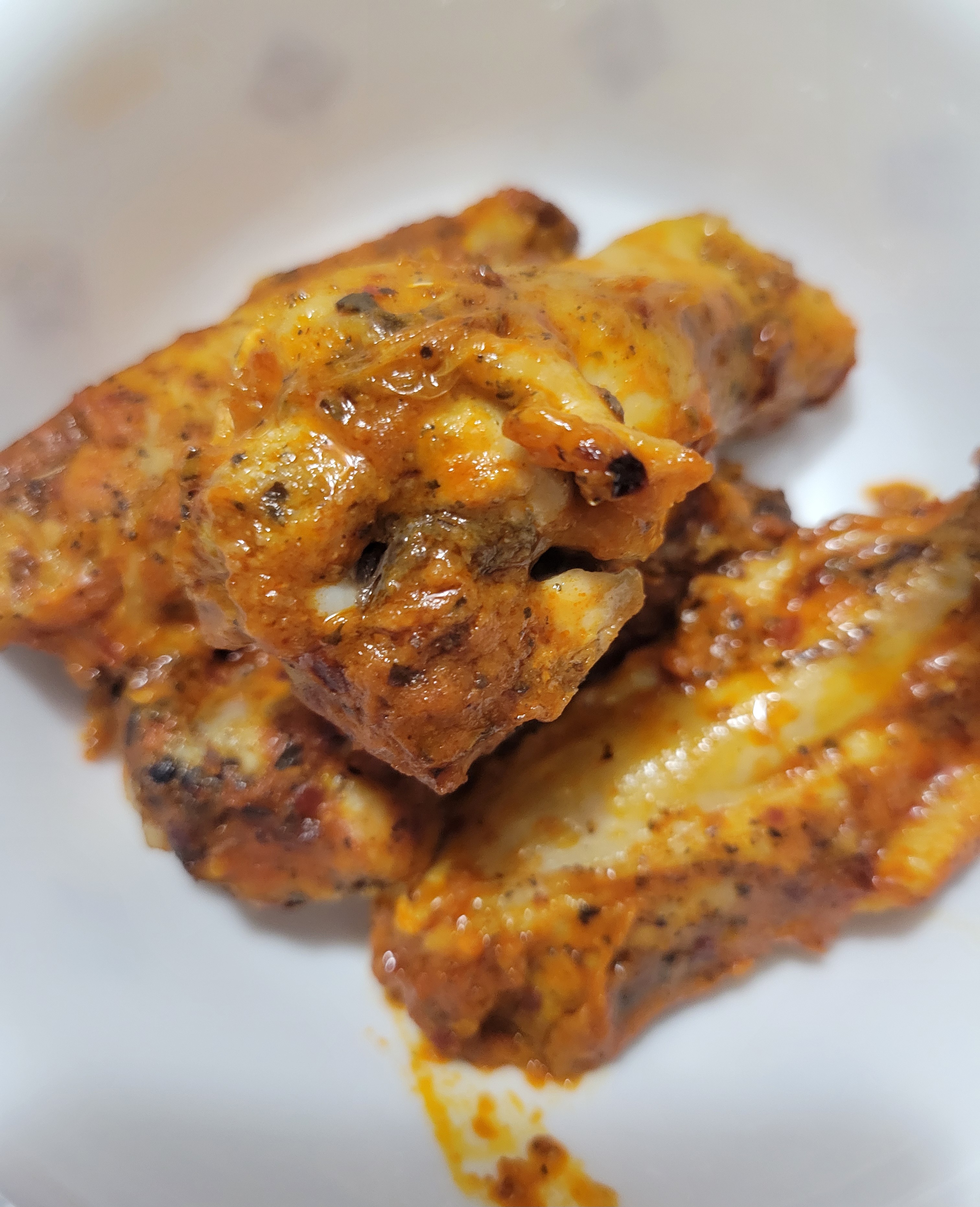 Chicken wings in a bowl.