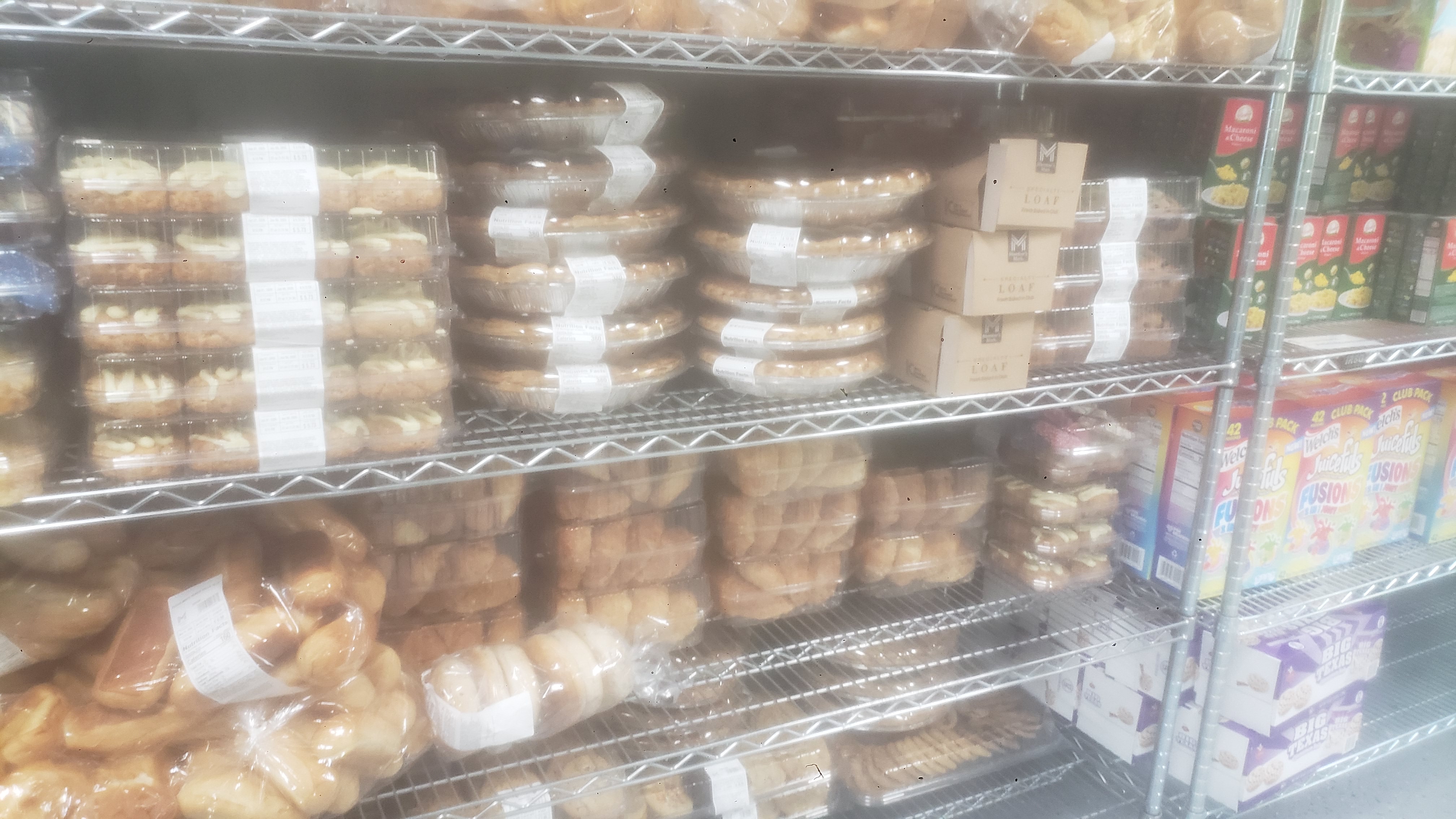 A variety of packaged baked goods on a shelf.