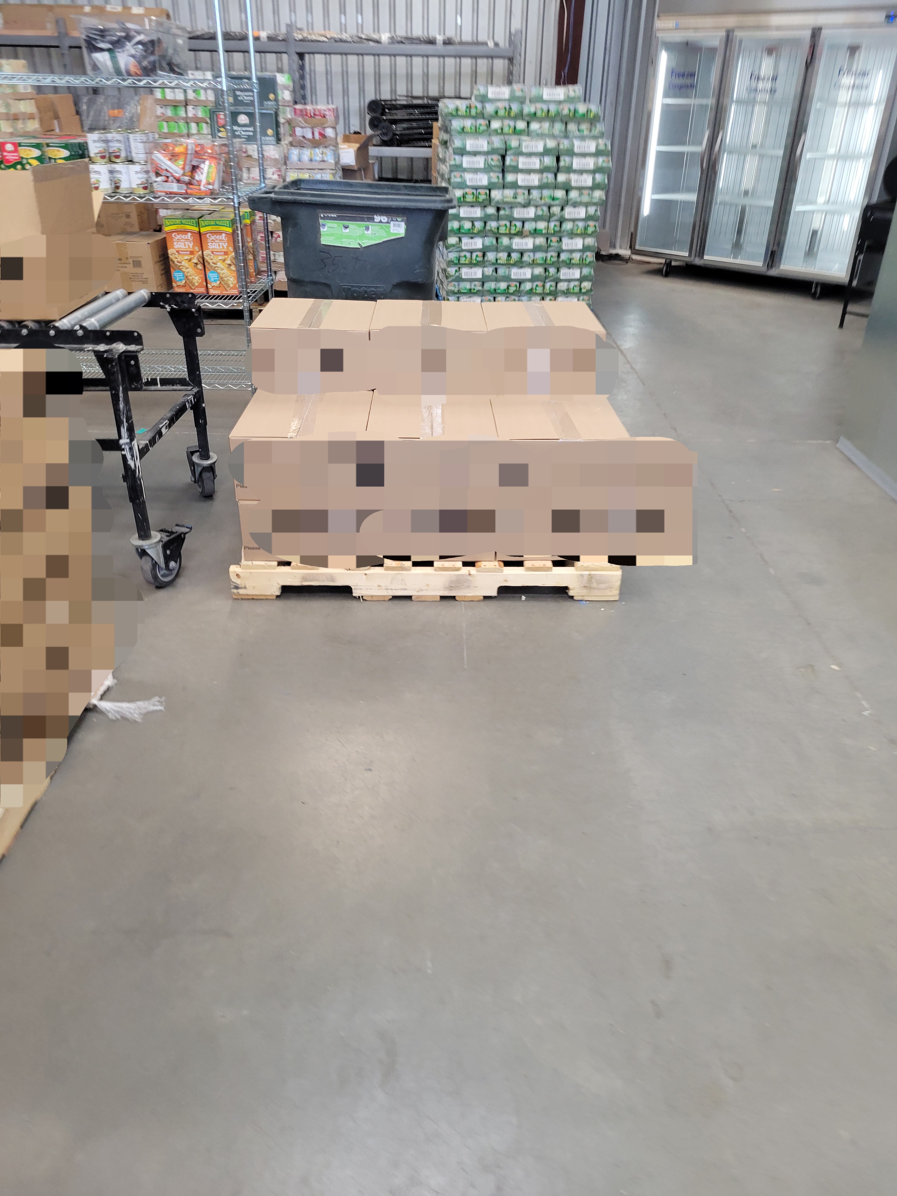 15 cardboard boxes on a pallet .