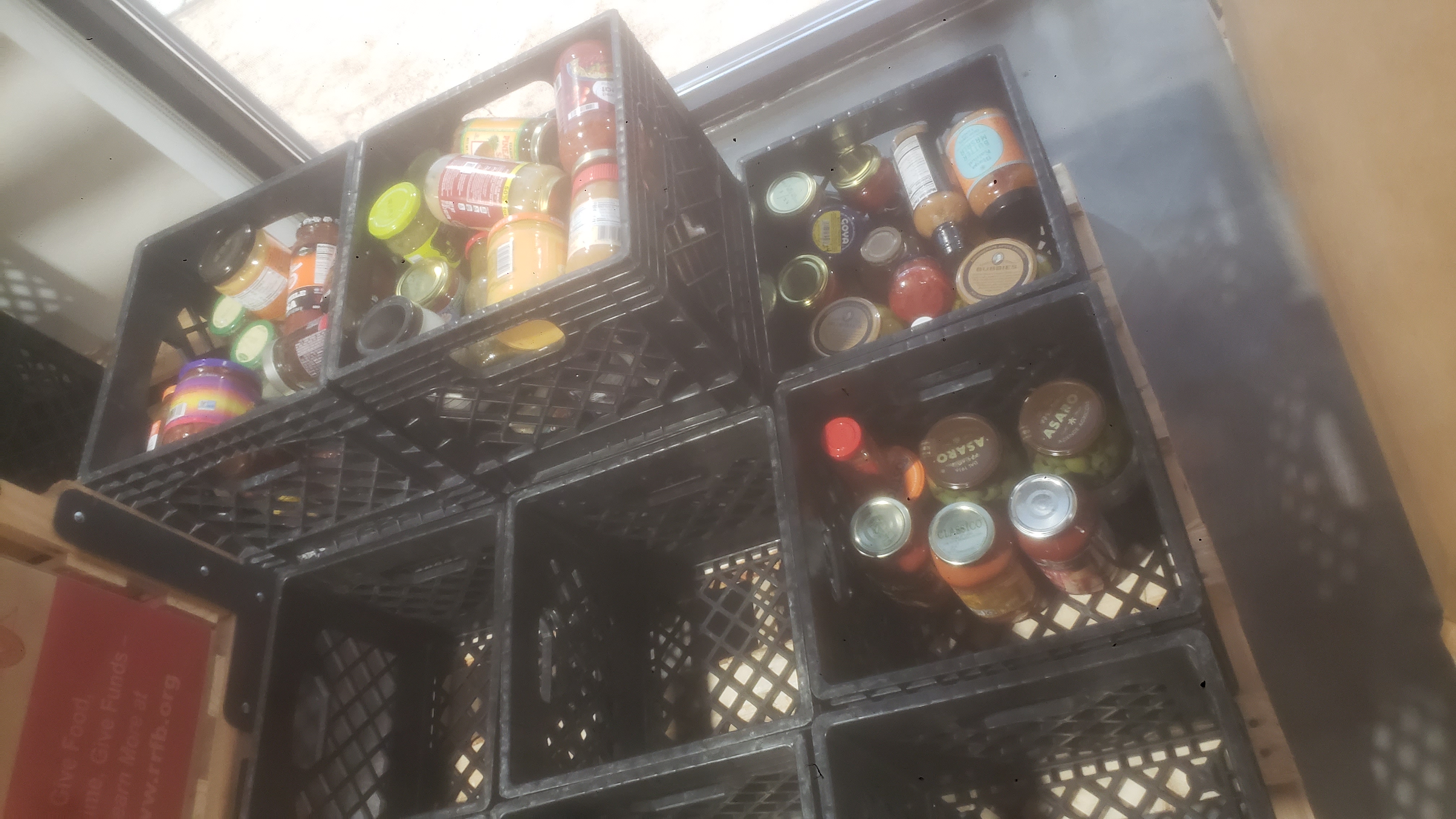 Crates filled with glass jars.