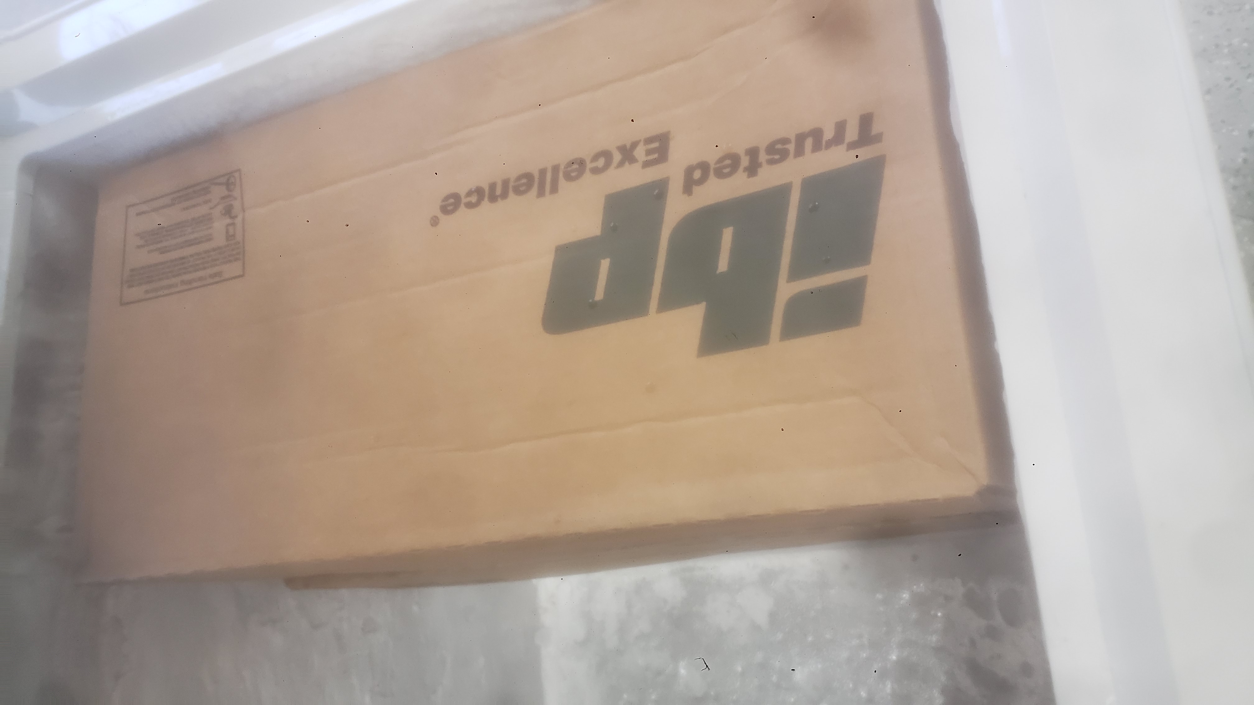 Cardboard boxe in a chest freezer.