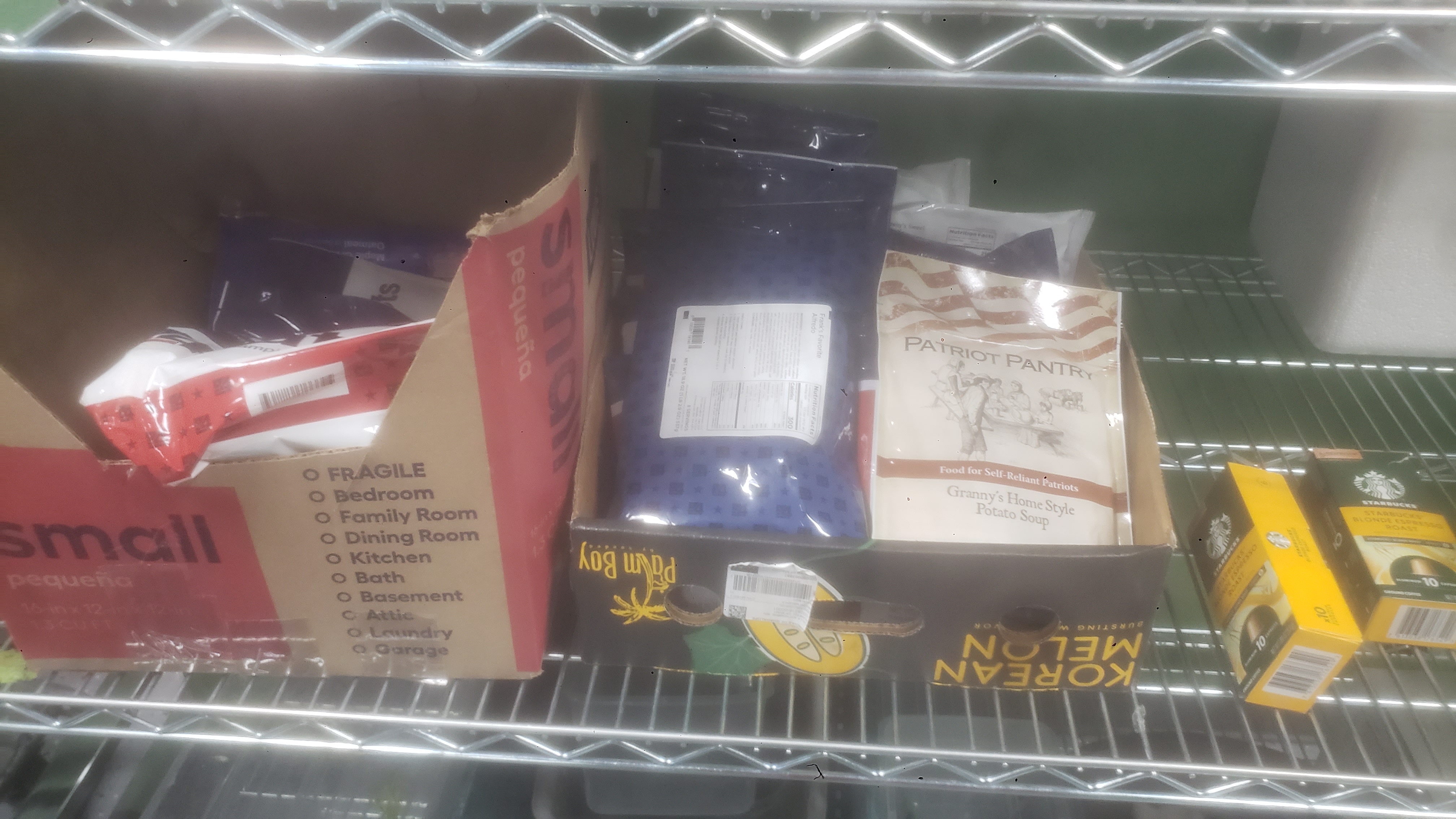 Box and tray filled with ready to eat meals on a shelf