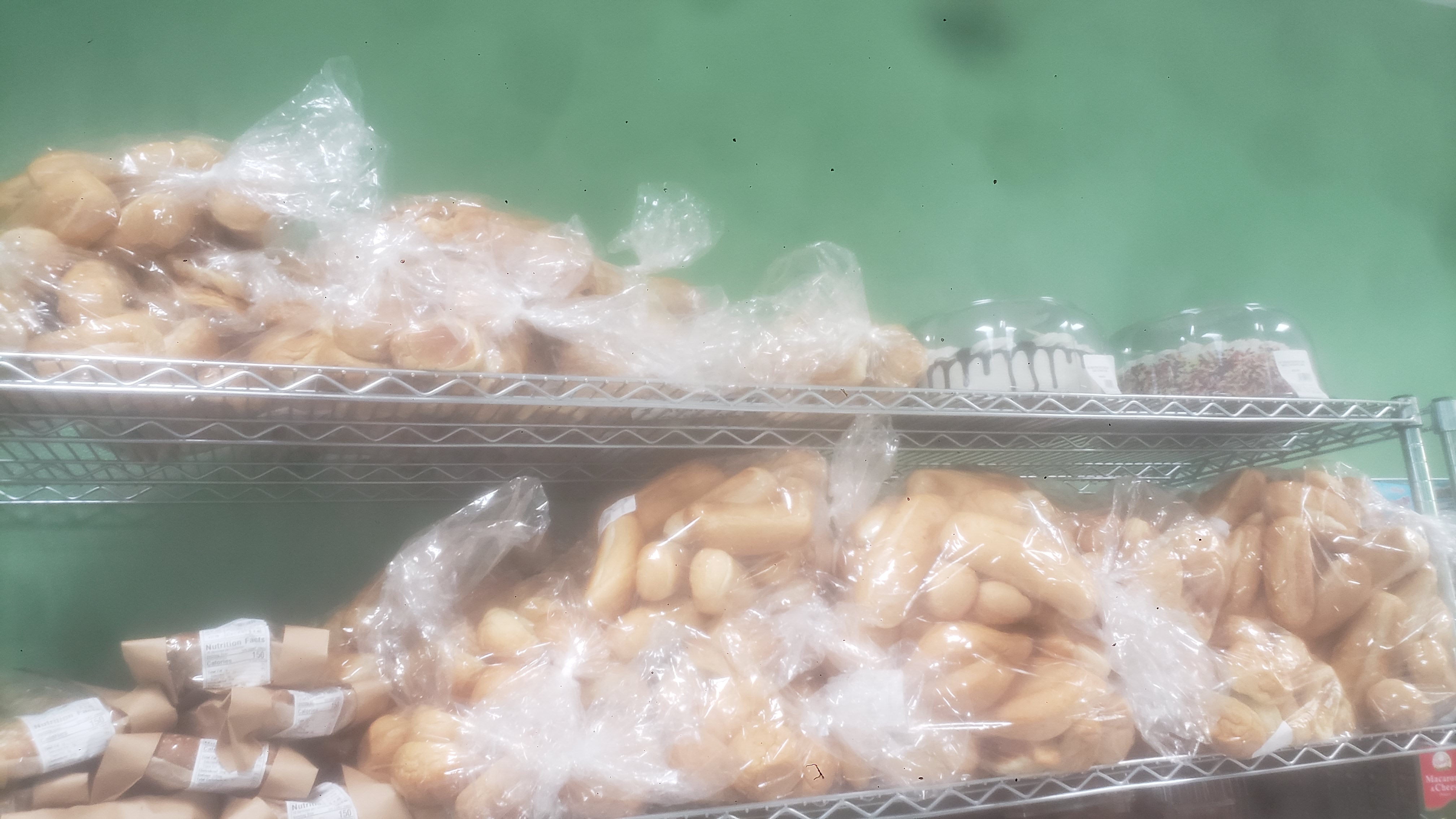 A variety of packaged baked goods on a shelf.