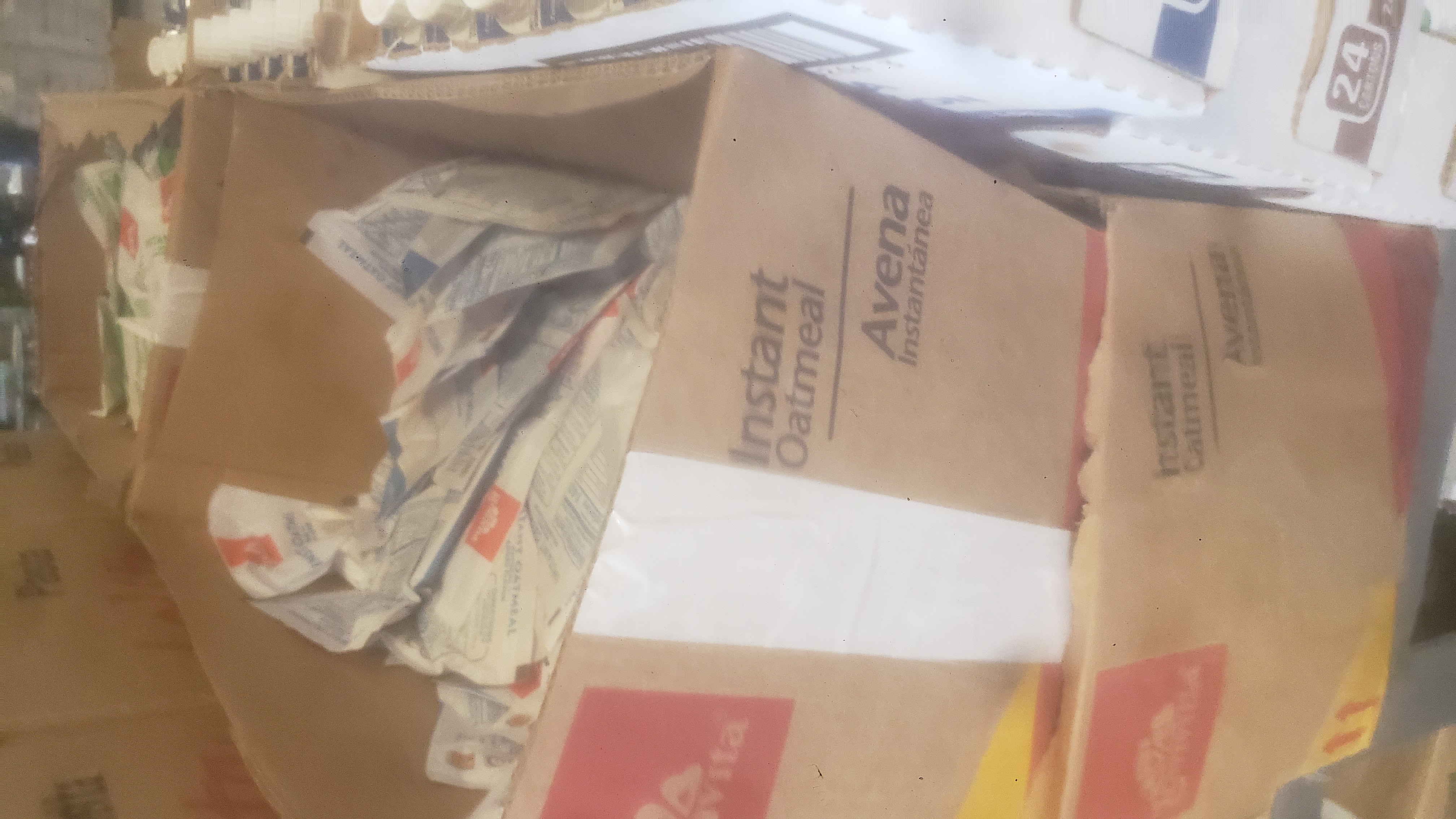 Packets of oatmeal in cardboard boxes.