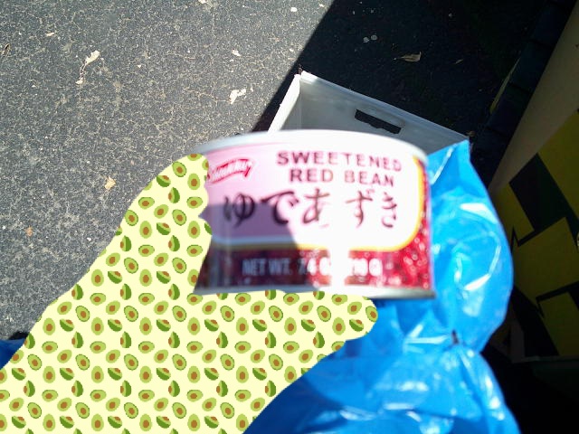 Hand holds can of sweetened red bean.