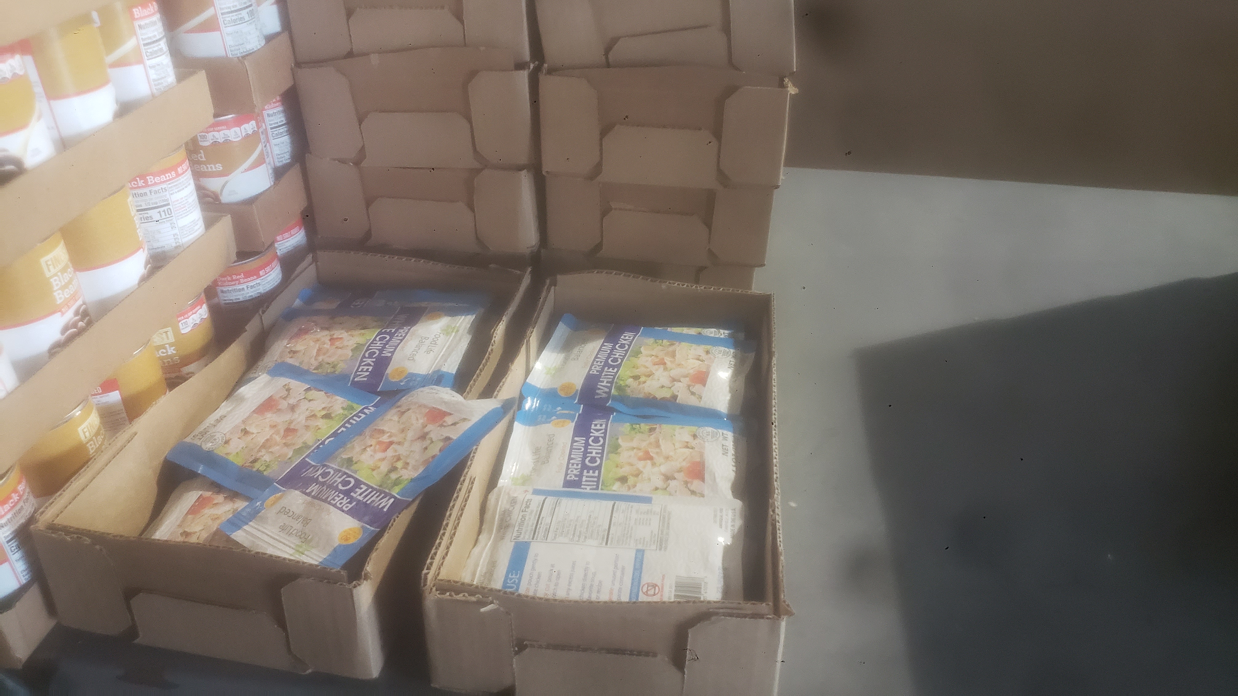 10-ounce pouches of chicken in cardboard boxes.
