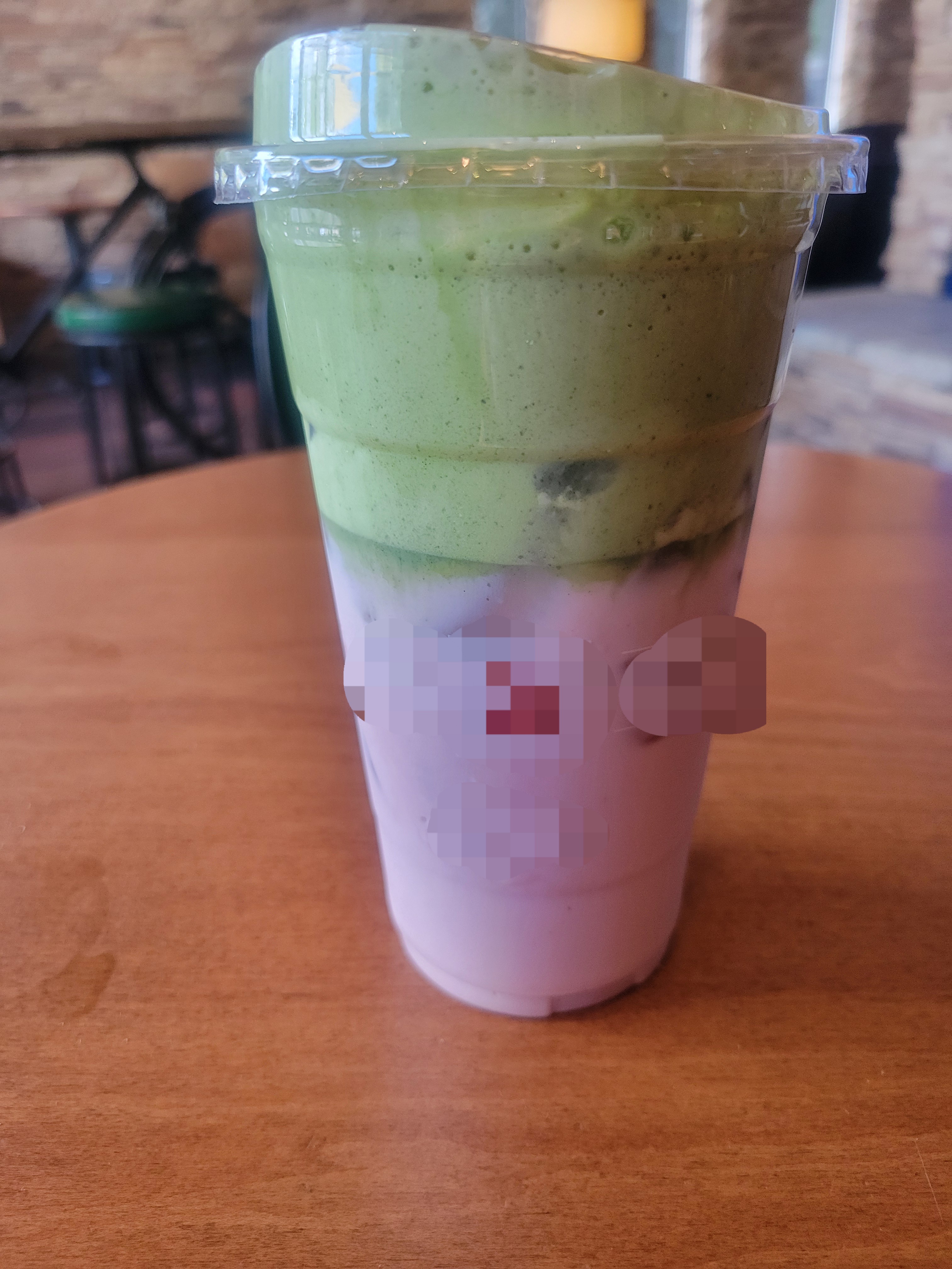 Strawberry matcha on a wooden table.
