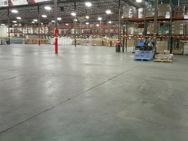 Warehouse with a section blocked by caution tape.