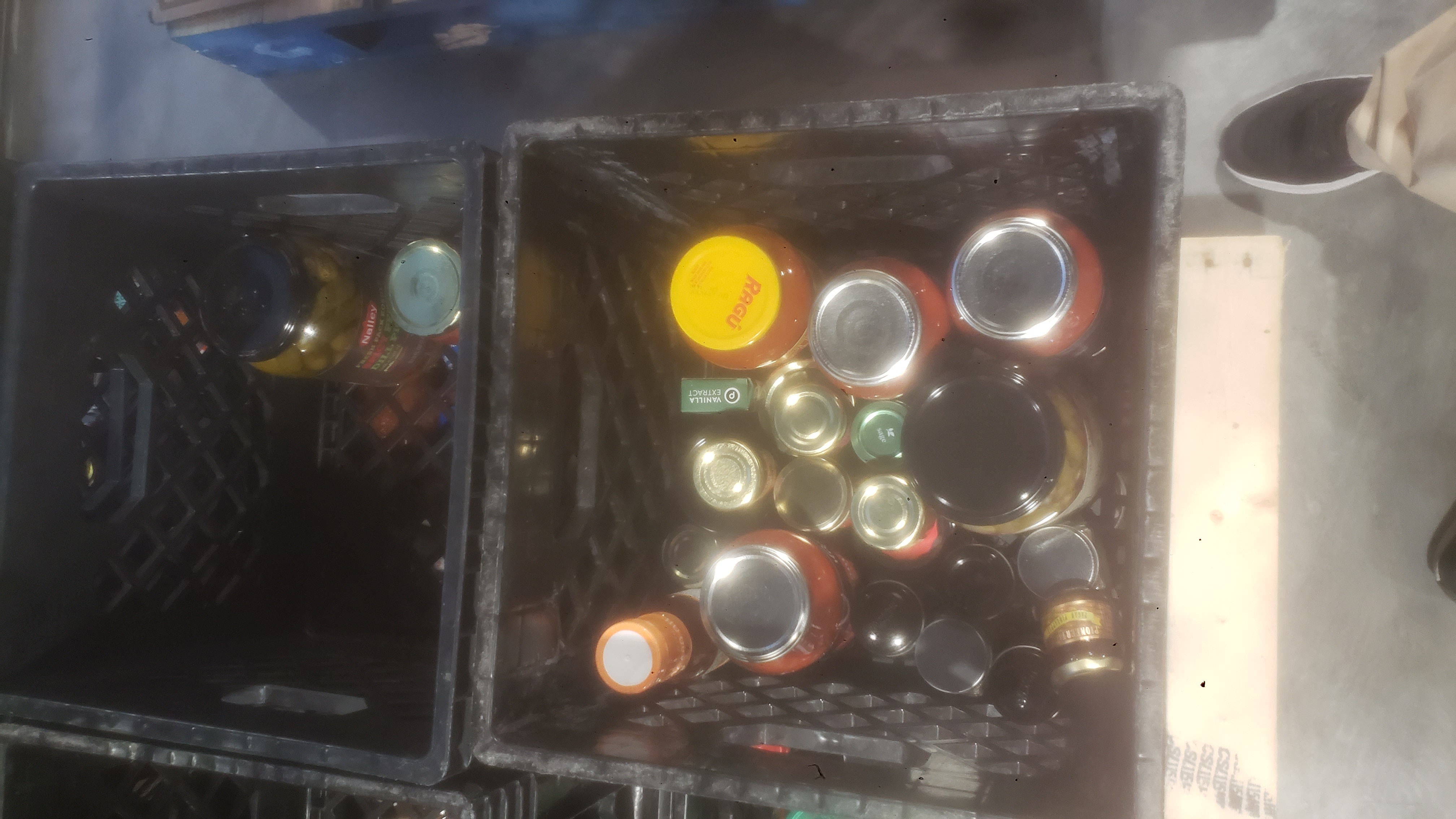 Crates filled with glass jars.