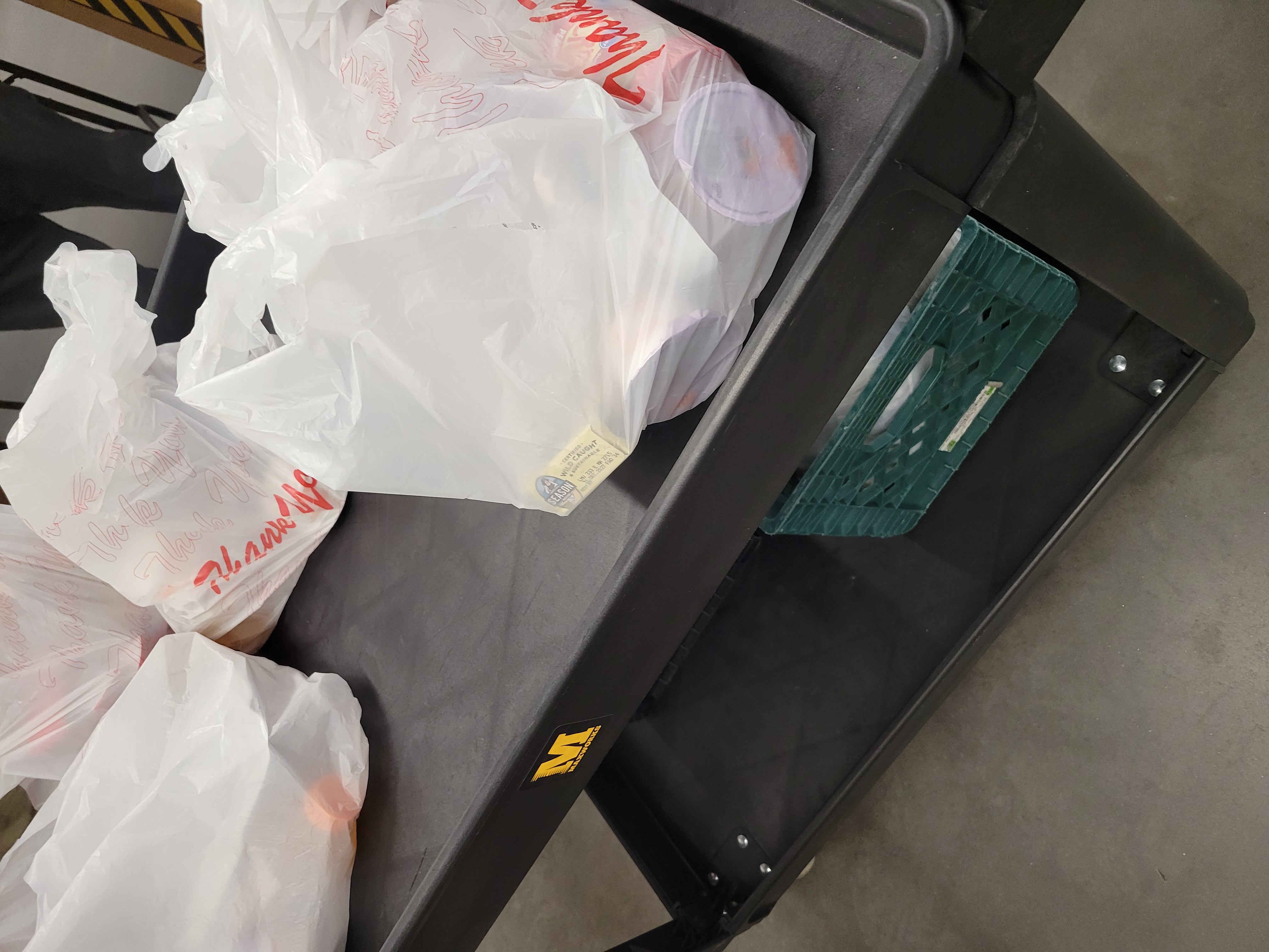 Plastic bags on top of cart.