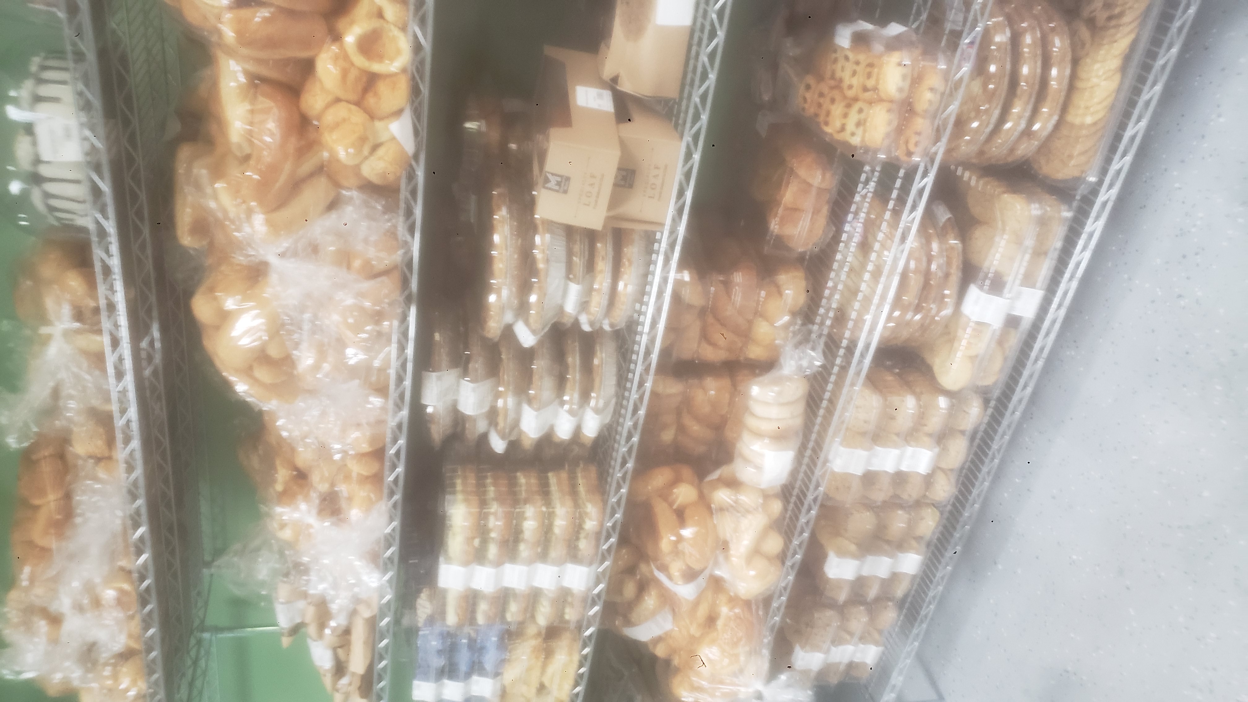 Assorted baked goods on a shelf.