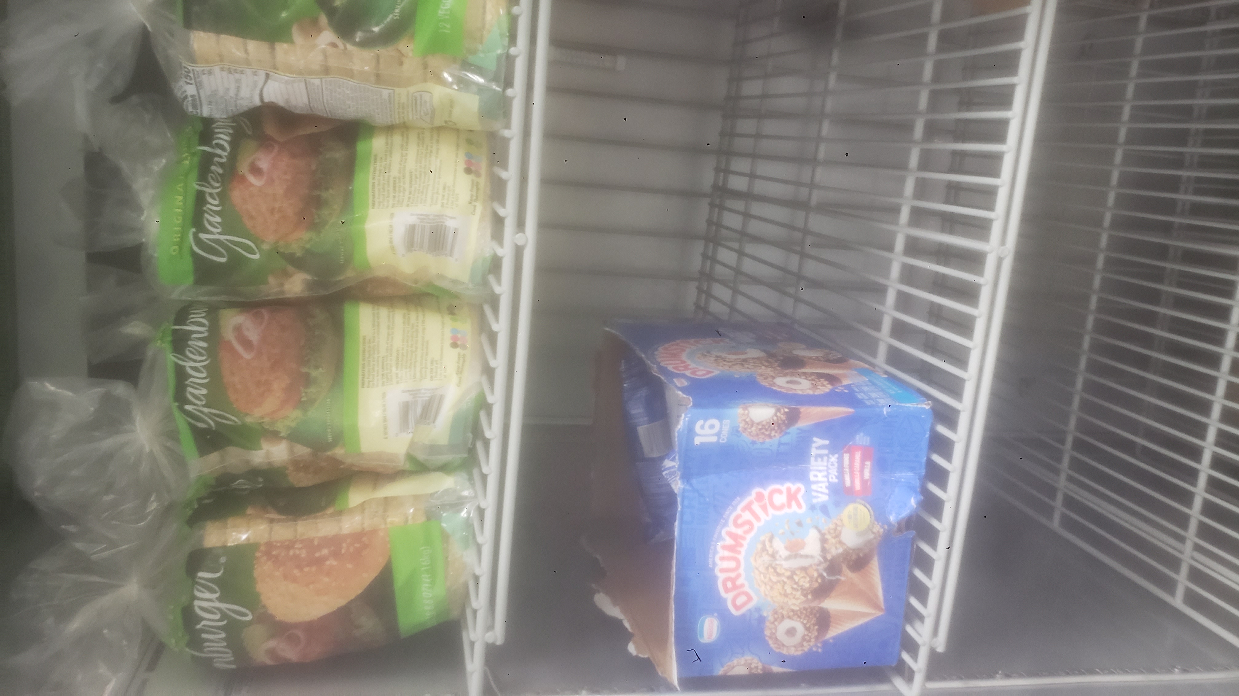 Bags of veggie burgers and box of ice cream.