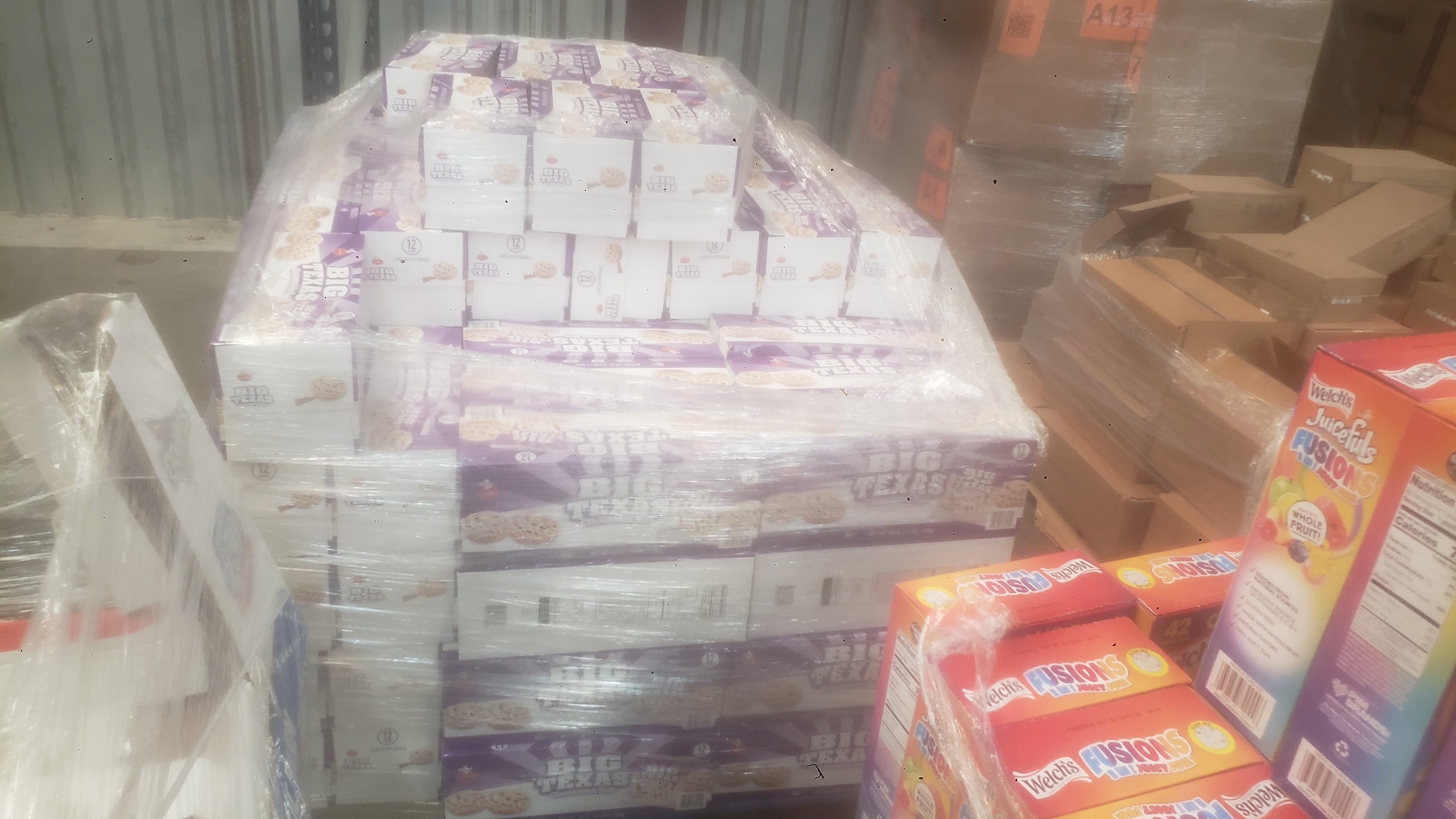 Boxes of cinnamon rolls on a pallet.