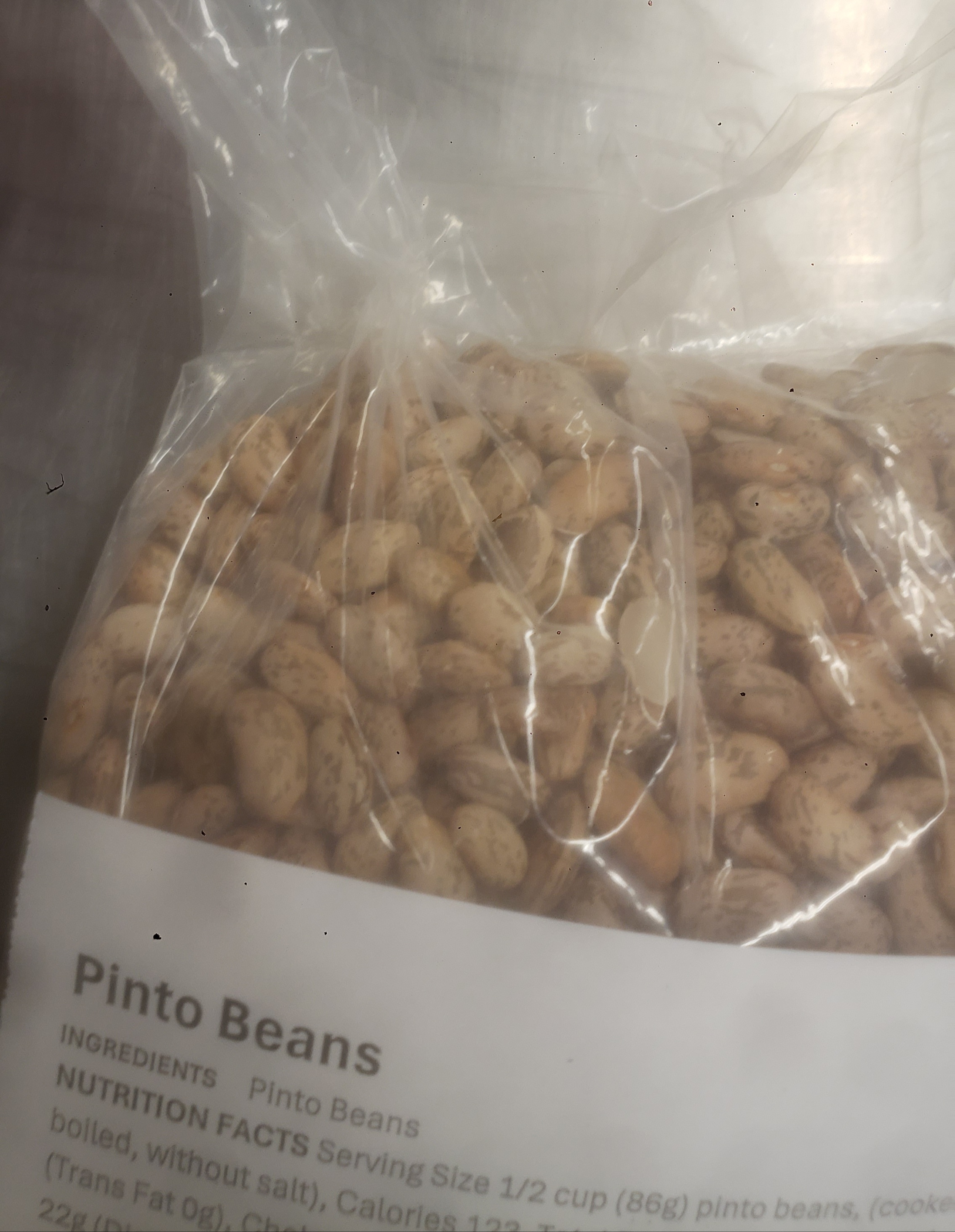 Bag of pinto beans with label.