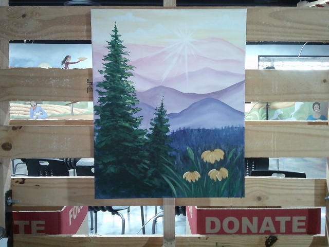 A painting of a sunrise over layered mountain ranges with evergreen trees and yellow flowers in the foreground.