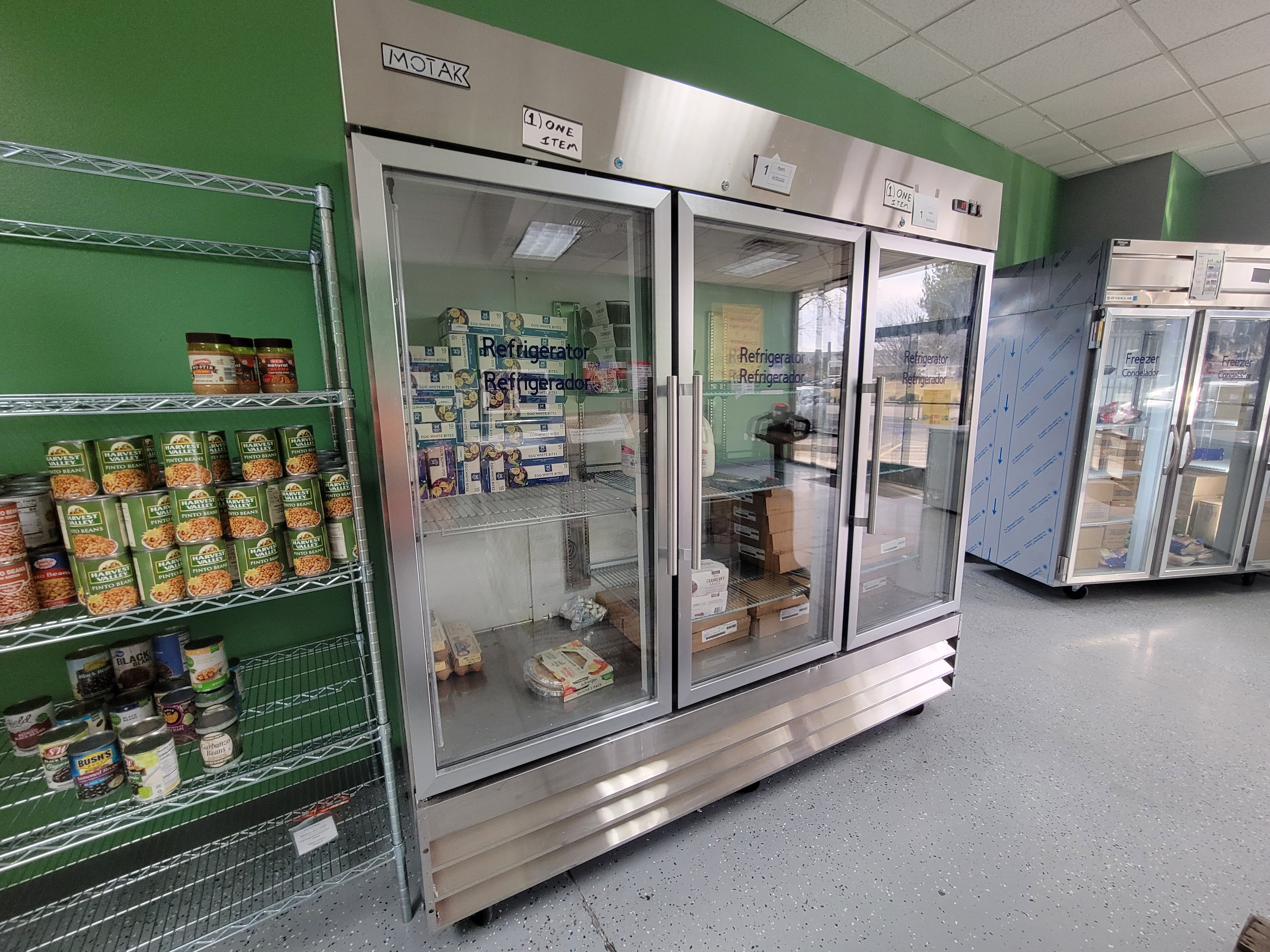 Food filled shelves, fridge, and freezer
