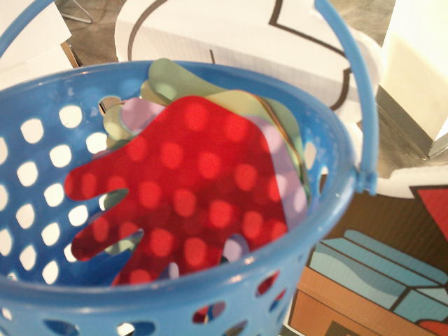 Paper hands in a basket.