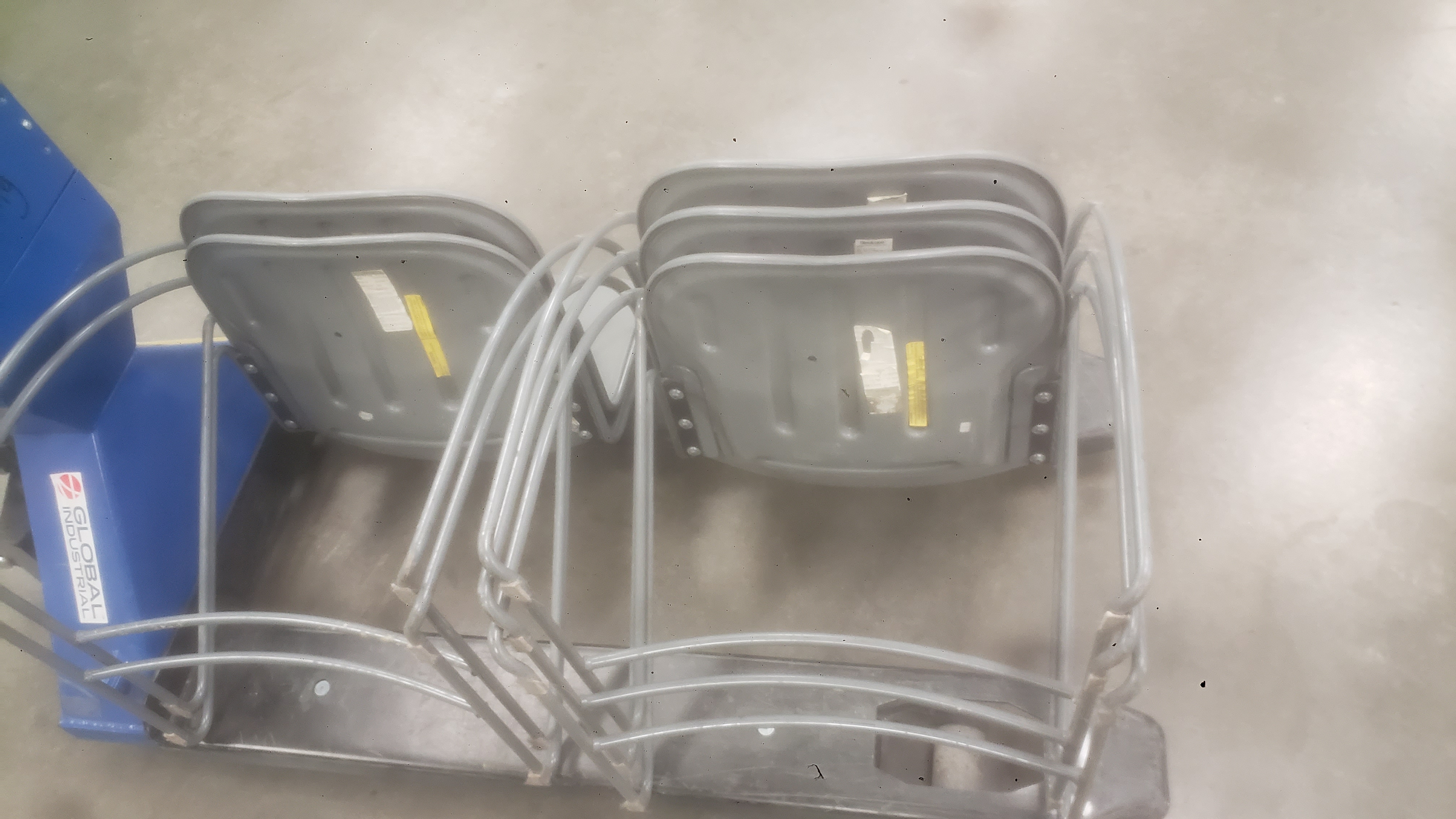 Chairs on a pallet jack.