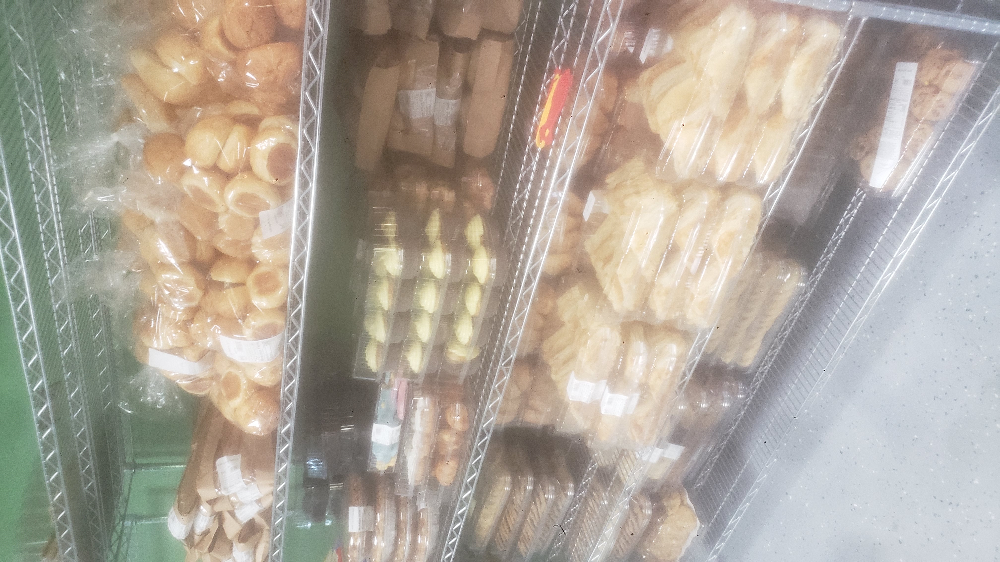 A variety of packaged baked goods on a shelf.