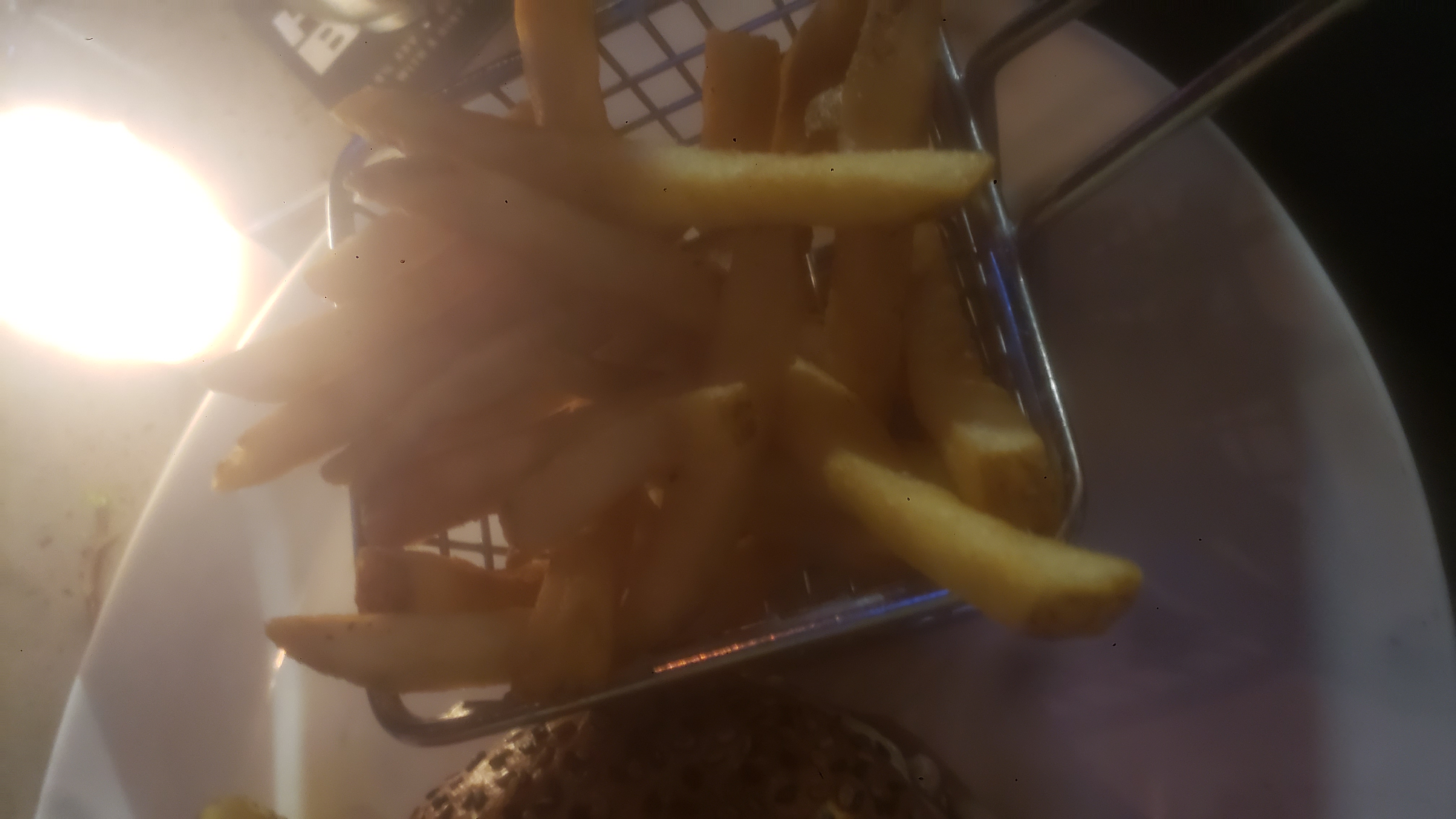 Fries in a small fry basket.